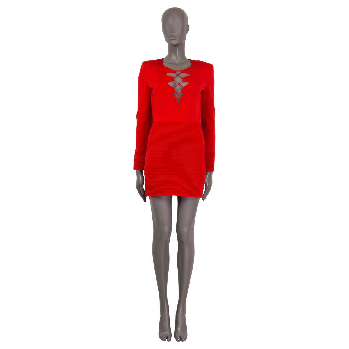 100% authentic Balmain long sleeve dress in red viscose (81%), polyamide (17%) and elastane (2%). Features lace-up detail at the deep v-neck and padded shoulders. Opens with a golden zipper on the back. Unlined. Has been worn and is in excellent