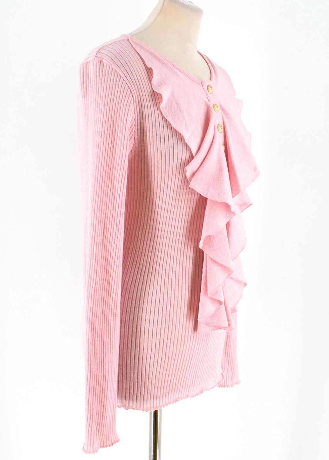 Balmain ruffle-neck ribbed-wool top

- Blossom-pink, lightweight ribbed-knit wool
- Round neck, long sleeves 
- Ruffle-trimmed neckline 
- Centre-front half push-stud fastening, gold-tone metal lion head embossed buttons 

Please note, these items