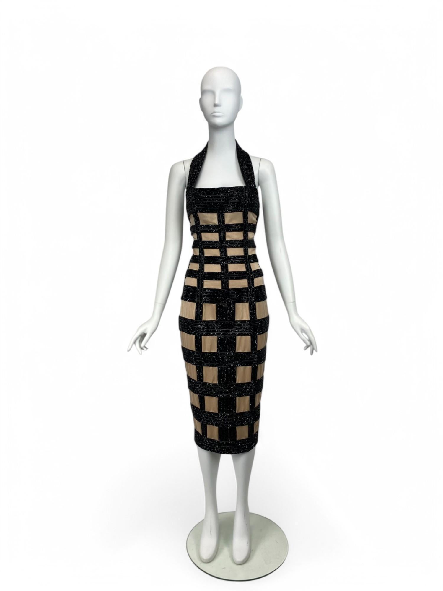 A true collector’s piece from Olivier Rousteing’s standout Spring/Summer 2015 collection for Balmain, this striking beaded windowpane dress is the ultimate statement of bold femininity and architectural glamour.

Worn on the runway by Kendall