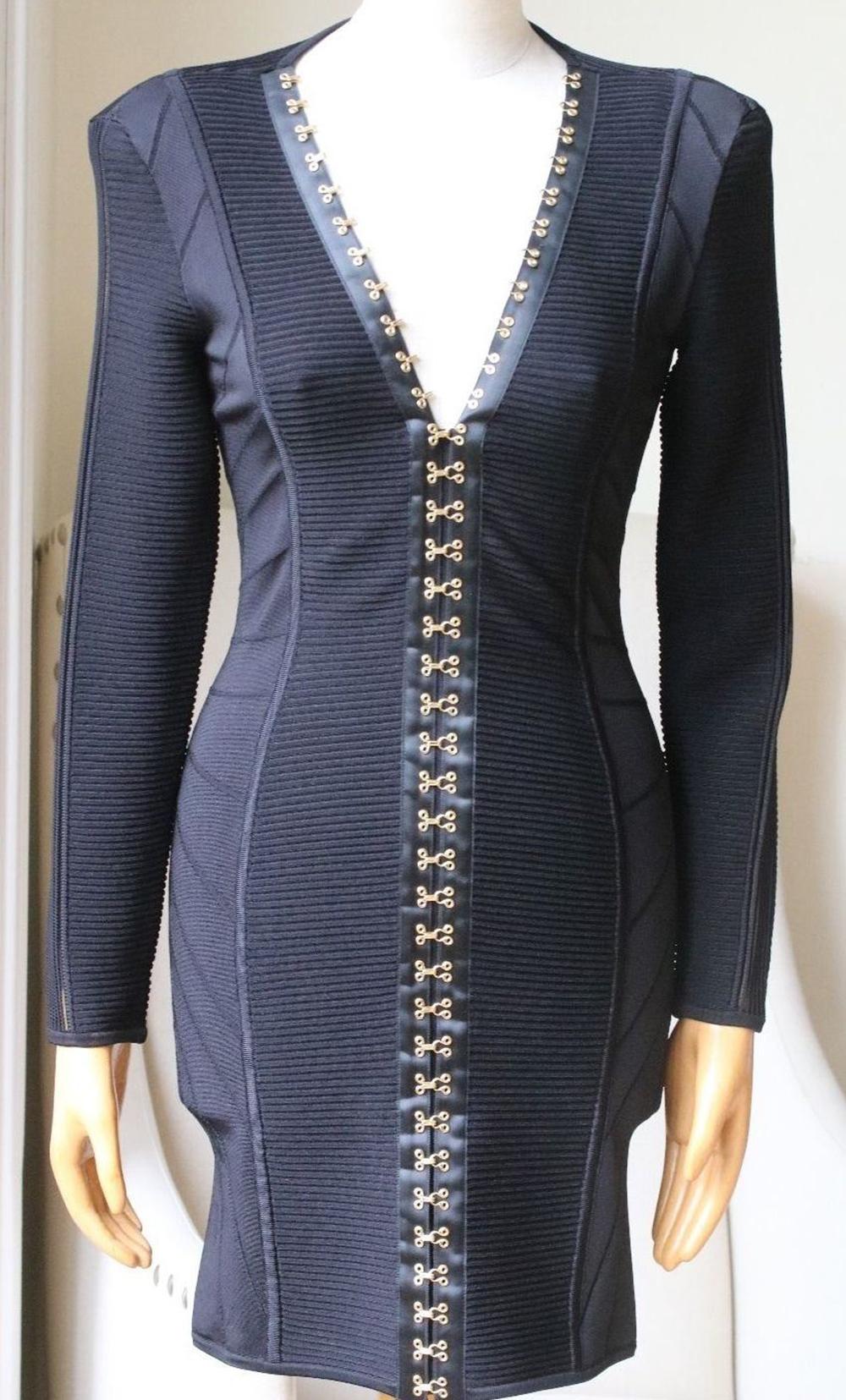 Balmain black dress. Bandage. Ribbed panels, good hook and eye embellishments, satin and tulle trims. Zip fastening along back. 83% Viscose, 16% polyamide, 1% elastane.

Size: FR 38 (UK 10, US 6, IT 42)

Condition: As new condition, no sign of wear. 