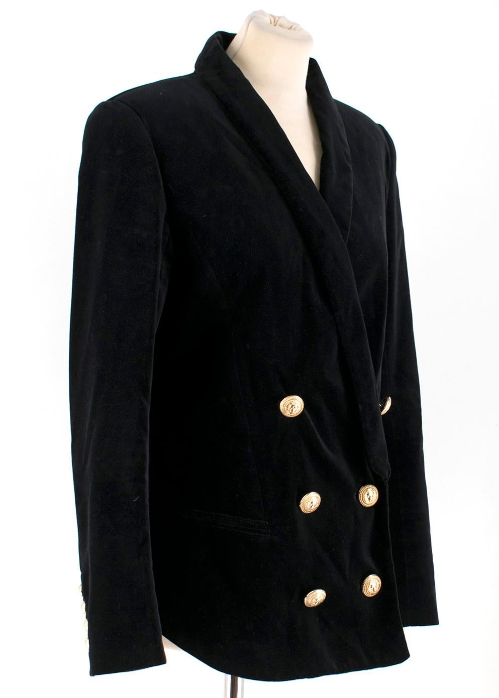 Balmain Shawl-lapel Double-breasted Velvet Blazer

- Black, wool velvet blazer
- Double- breasted buttoned fastening
- Gold-tone embossed buttons at front and cuffs
- Long-sleeved
- Padded shoulders
- Back vent
- Two front decorative pockets
-