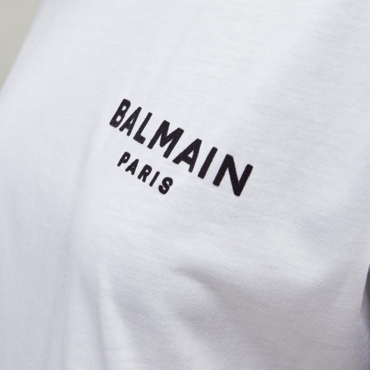 BALMAIN signature logo print cuffed sleeves white cotton tshirt XXS
Reference: AAWC/A00769
Brand: Balmain
Designer: Olivier Rousteing
Material: Cotton
Color: White, Black
Pattern: Solid
Extra Details: Velvet print. Cuffed sleeves.
Made in: