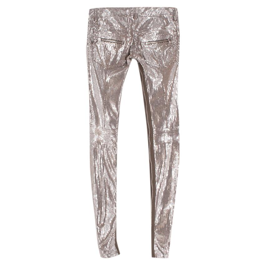 Balmain Silver Sequin Skinny Fit Zipper Detail Trousers

-Gorgeous sequin texture 
-Zip details to the inside legs that allow for styling versatility 
-Cotton jersey fabric to the inside for comfort 
-4 pockets to the front, 2 to the back 
-Zip