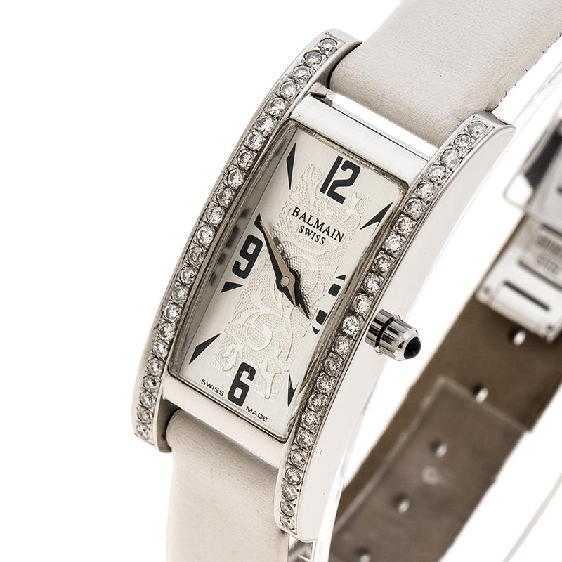 This Balmain watch is a perfect alternative to your regular timepiece. It features a white stainless steel body with a case diameter of 18mm. It comes with a silver, white rectangular dial detailed with black markers and hands. It features an