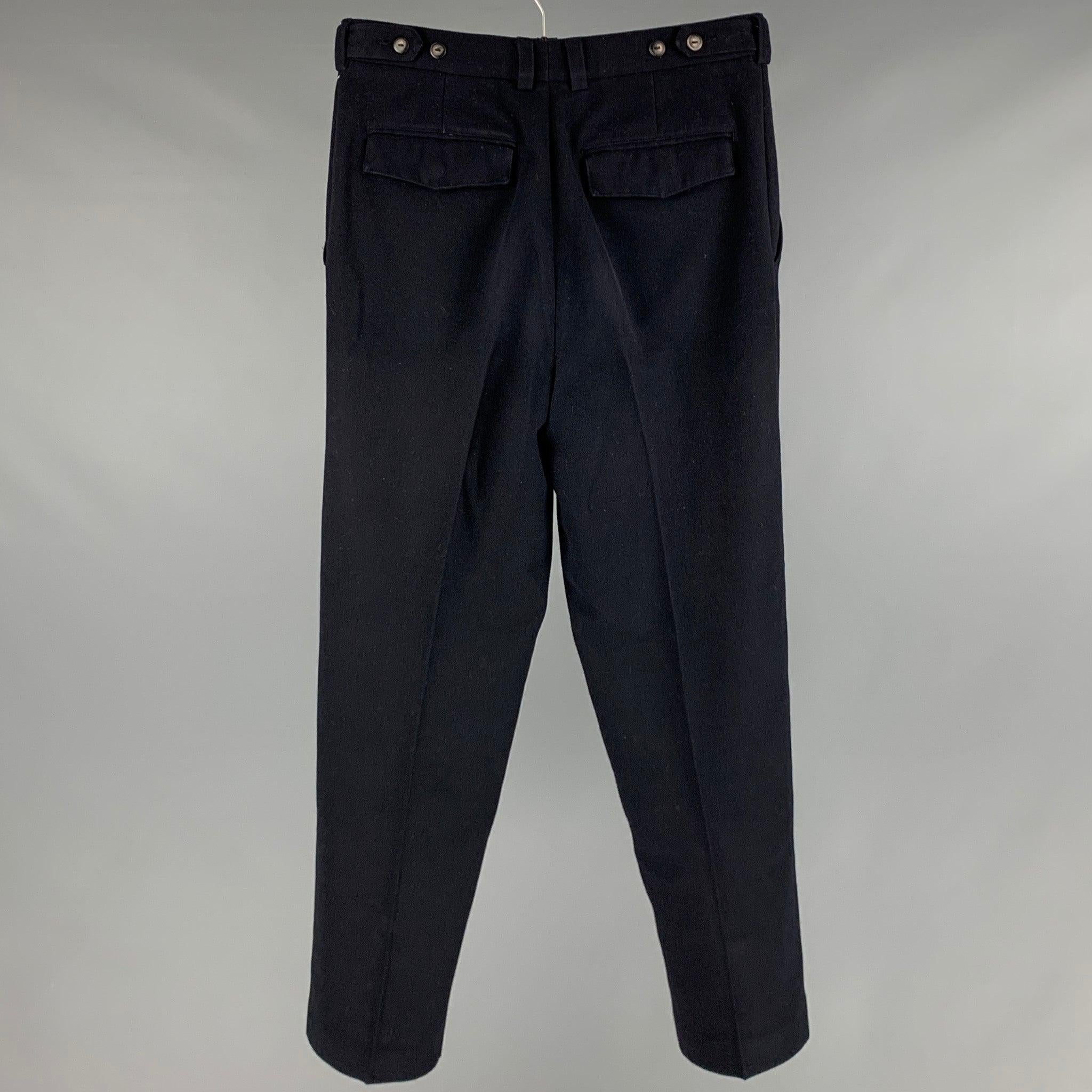 BALMAIN dress pants
in a black polyester blend fabric featuring a high waisted look, flat front style, and zip fly closure. Excellent Pre-Owned Condition. 

Marked:  32 

Measurements: 
 Waist: 32 inches Rise: 10.5 inches Inseam: 30 inches Leg