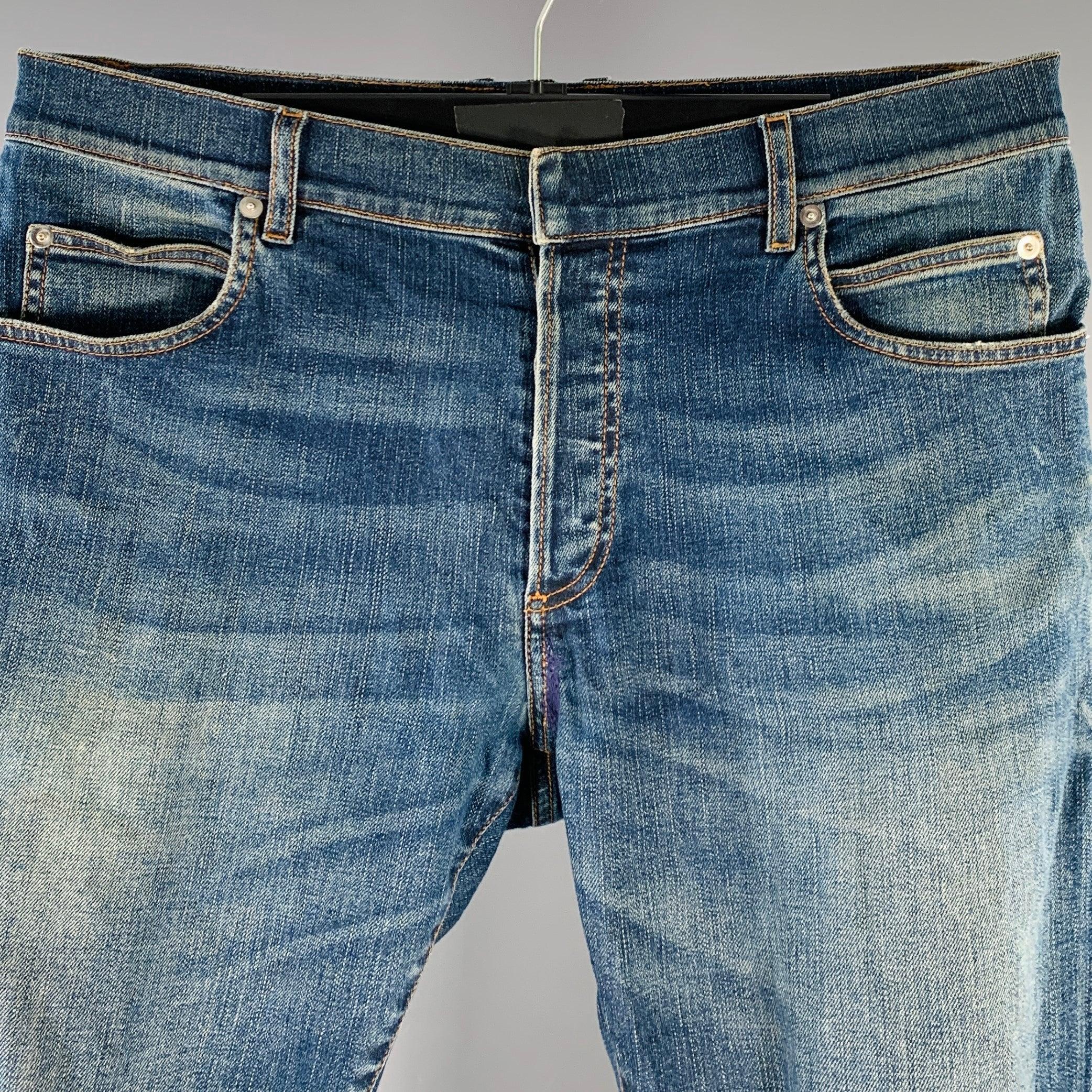 BALMAIN jeans
in a blue cotton stretch blend denim featuring yellow contrast stitching, skinny fit, and button fly closure. Made in Italy.Excellent Pre-Owned Condition. 

Marked:   32 

Measurements: 
  Waist: 32 inches Rise: 8.5 inches Inseam: 31