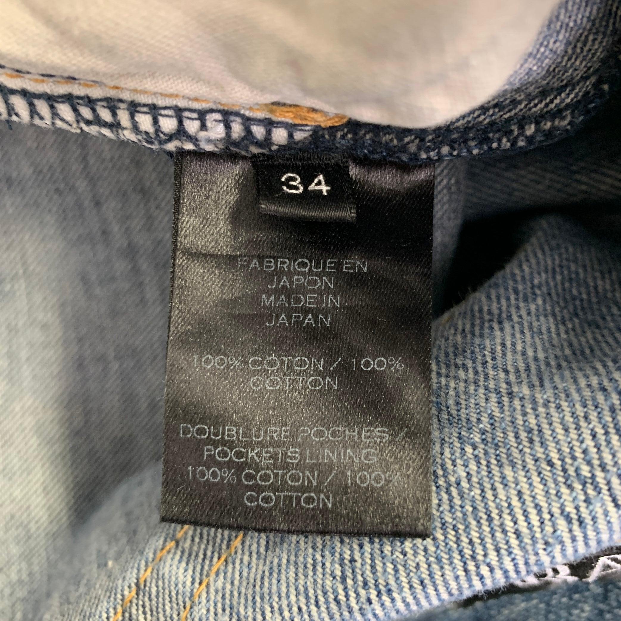 De los hombres Pantalones vaqueros con botones BALMAIN talla 34 lavado índigo