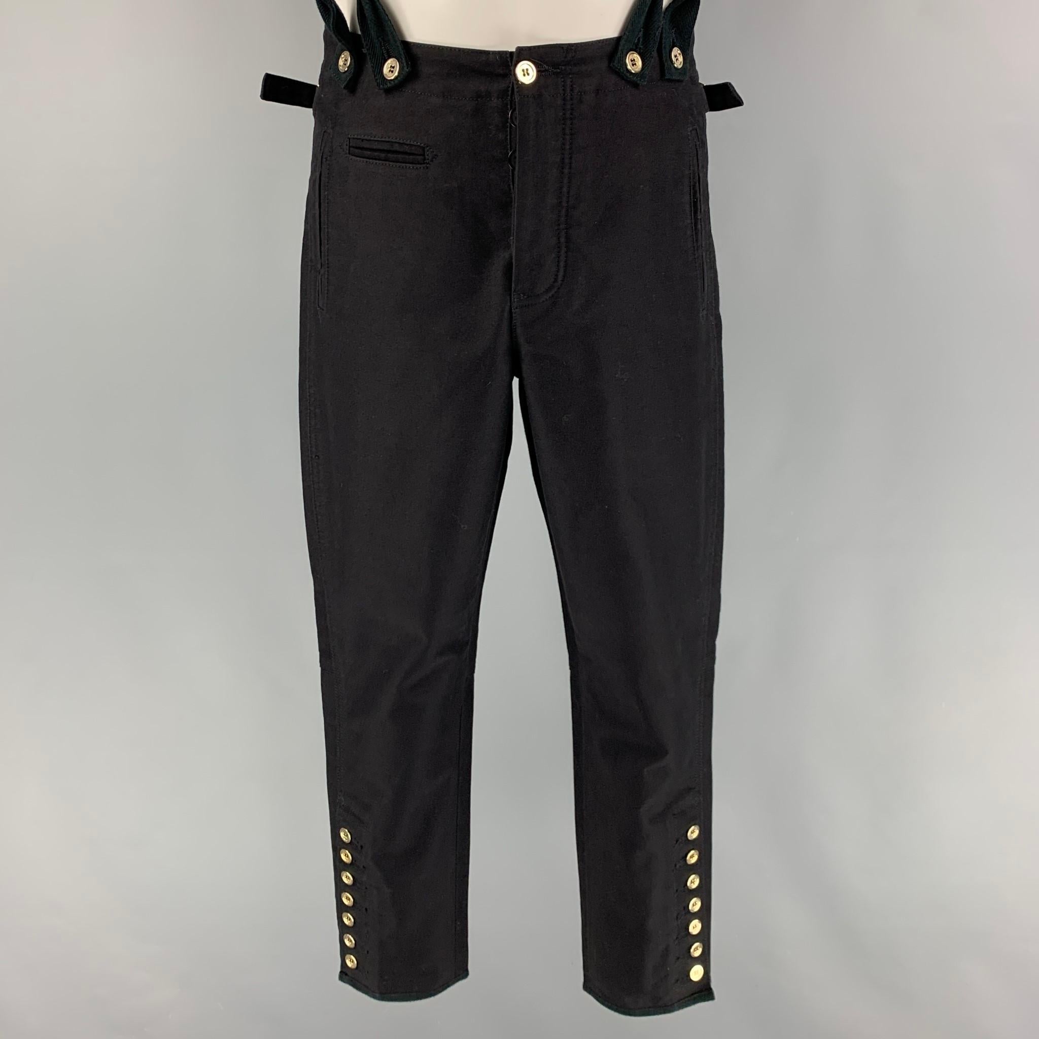 BALMAIN pants comes in a black cotton featuring a jodhpurs style, gold tone buttons, suspenders buttons, side tabs, adjustable suspenders, and a button fly closure. Made in Italy. 

Very Good Pre-Owned Condition.
Marked: S

Measurements:

Waist: 28
