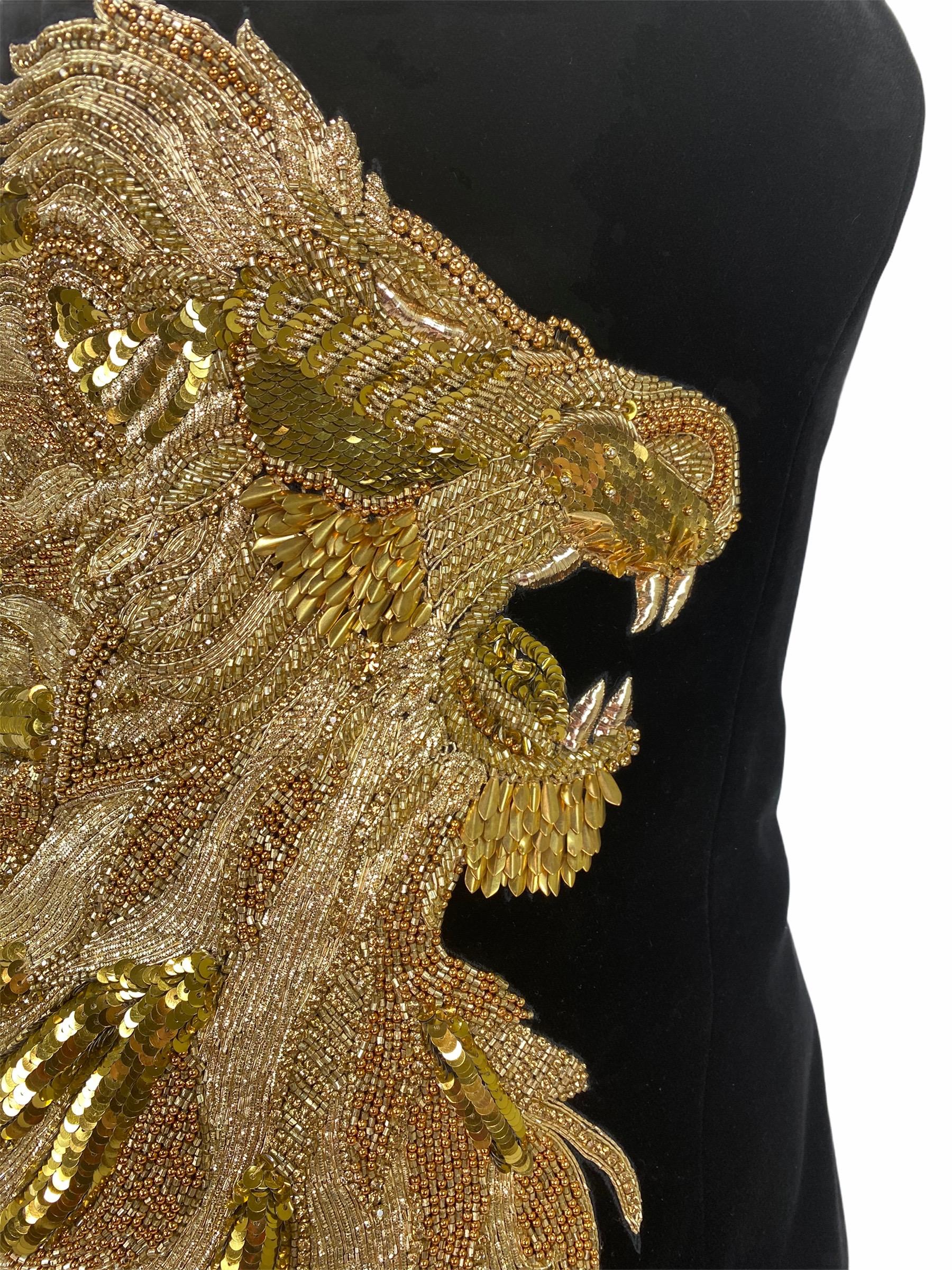 Balmain's Olivier Rousteing knows a thing or two about the perfect LBD – and with this version he takes the style to a new level. Ornately embroidered with the label's signature lion motif from sparkling gold sequins, this plush velvet dress has