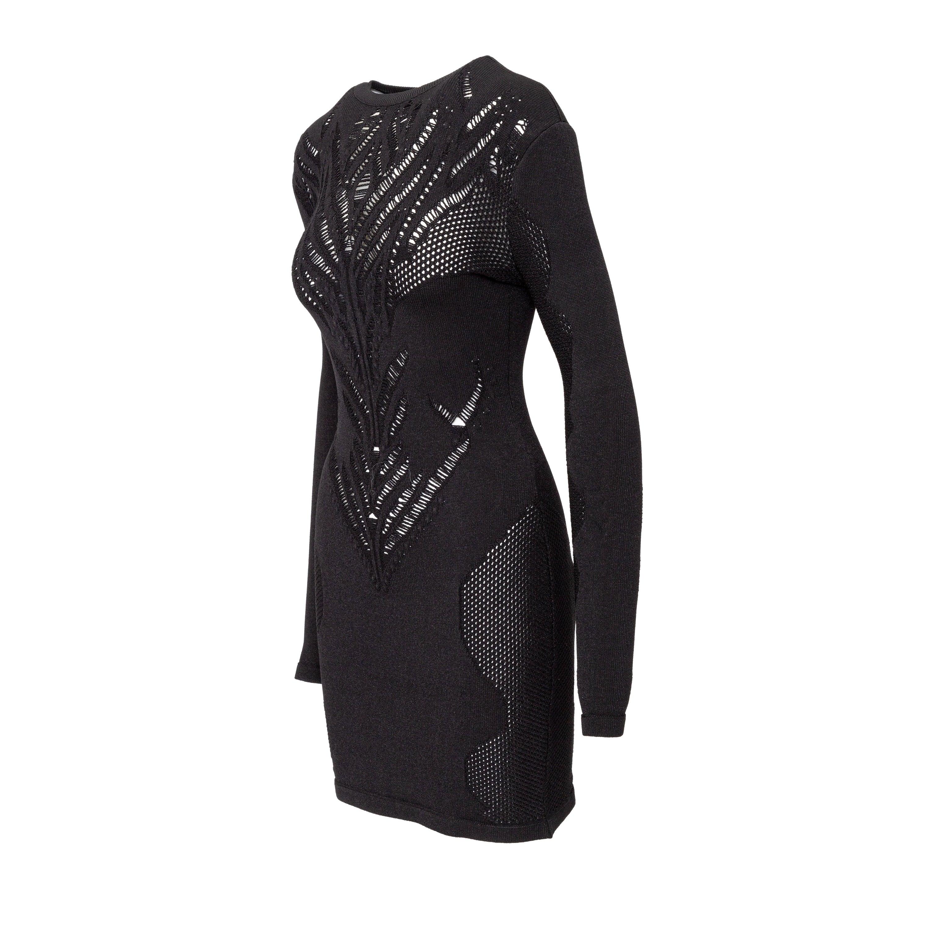 Elevate your evening wear in this Balmain dress. Crafted from a viscose blend, the stretchy jacquard fabric in black effortlessly hugs your curves for a flattering fit. With a round neck and long sleeves, the beautiful cutout pattern adds a touch of