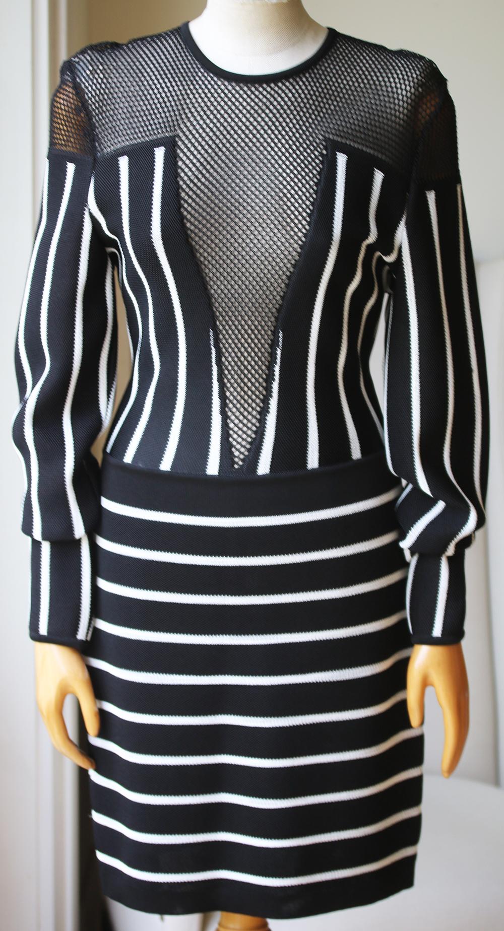 Black and white striped dress from Balmain. Silver-tone zip fastening at back. Mesh inserts at bodice. Elasticated round neck. 95% Polyester, 5% viscose.

Size: FR 40 (UK 12, US 8, IT 44)

Condition: As new condition, no sign of wear. 