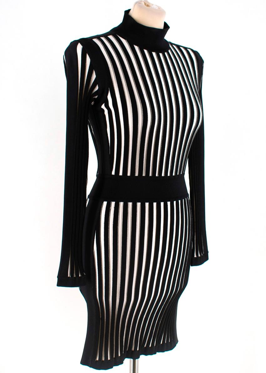 Balmain Short Black & White Striped Knit Dress. Features structured shoulders, a tight fitting silhouette, zip fastening at back, stand-up collar, and long sleeves. 


- 90% Viscose,  9% Polyamide, 1% Elastane
- Made in Italy

Please note, these