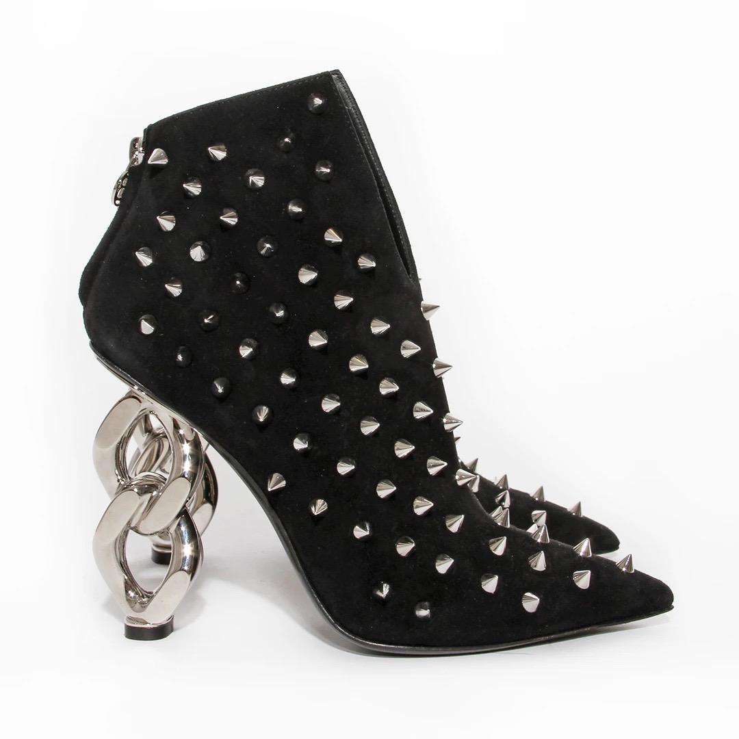 Vintage Balmain by Oliver Rousteing Bootie 
Fall / Winter 2019 Ready-to-Wear 
Made in Italy 
Black Suede 
Silver spiked studs allover bootie 
Front of bootie has a U shape dip
Silver toned oversized chain link heel 
Pointed Toe 
Silver B logo zipper