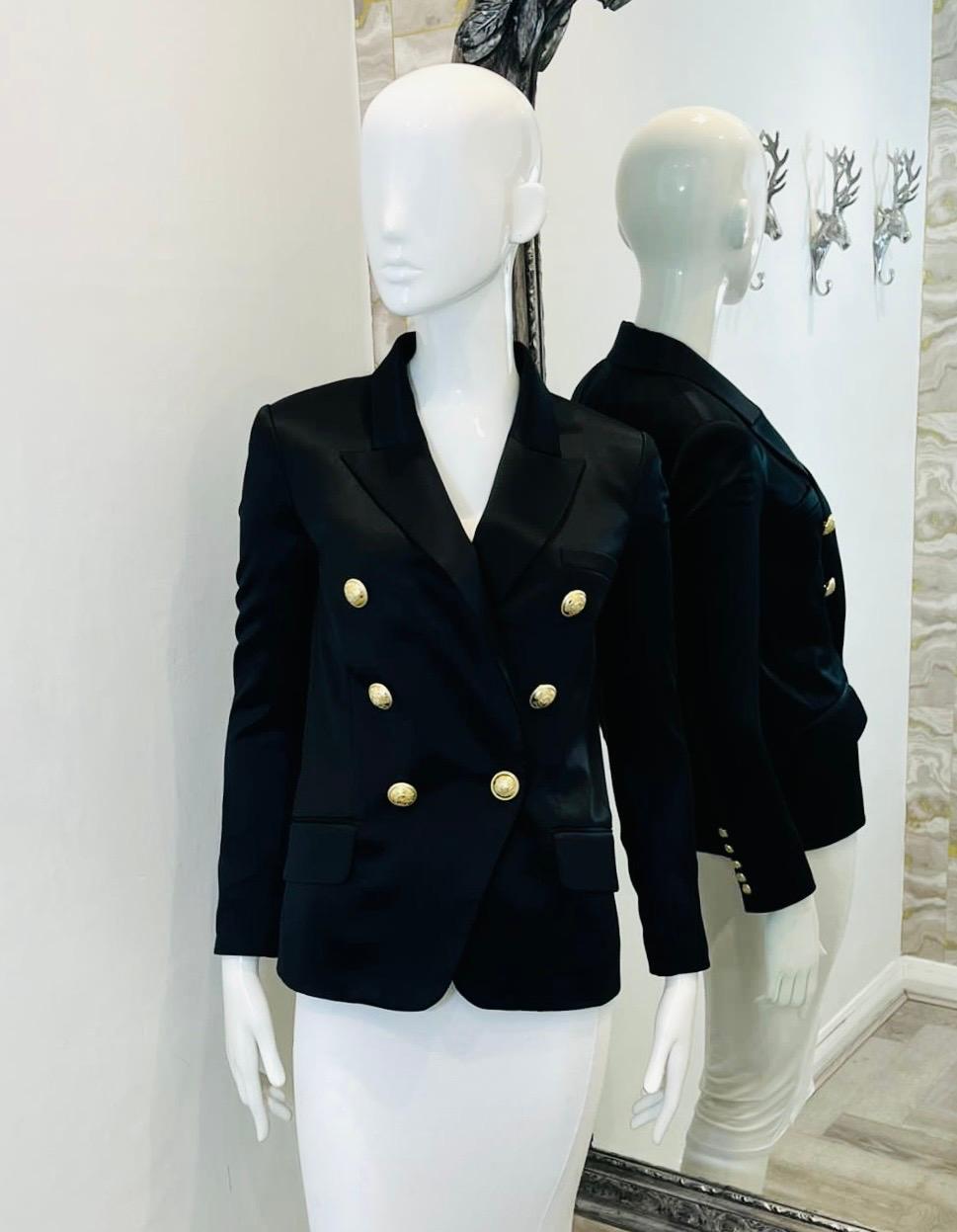 Balmain Tailored Silk Jacket

Black, double-breasted blazer designed with logo embroidered gold buttons.

Featuring notched lapels, flap pockets to the front and buttoned cuffs. Rrp £1850

Size –  34FR

Condition – Very Good (Minor pulls to the