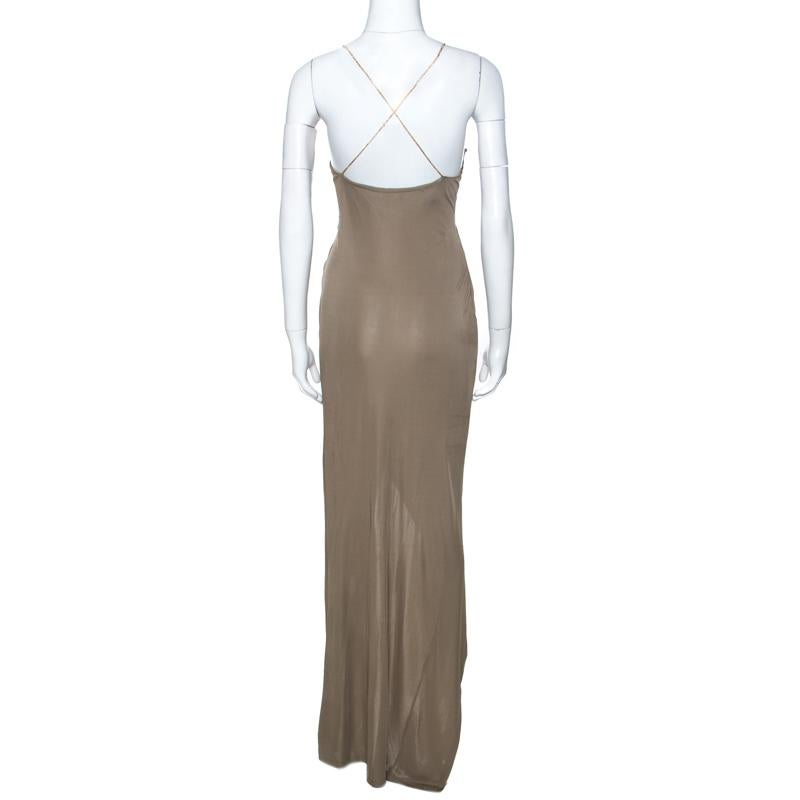 This lovely creation comes from the house of Balmain. It has been designed to deliver ultimate sophistication and subtle glamour. It is made from quality materials and comes in a lovely shade of taupe green. This dress has been styled with a