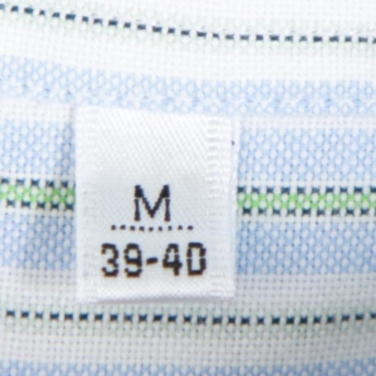 Highlighted by impeccable stitching and craftsmanship, this shirt from Balmain is made from 100& cotton. It features a striped pattern all over in subtle hues. The creation is complete with a classic collar, short sleeves, and buttoned closure.