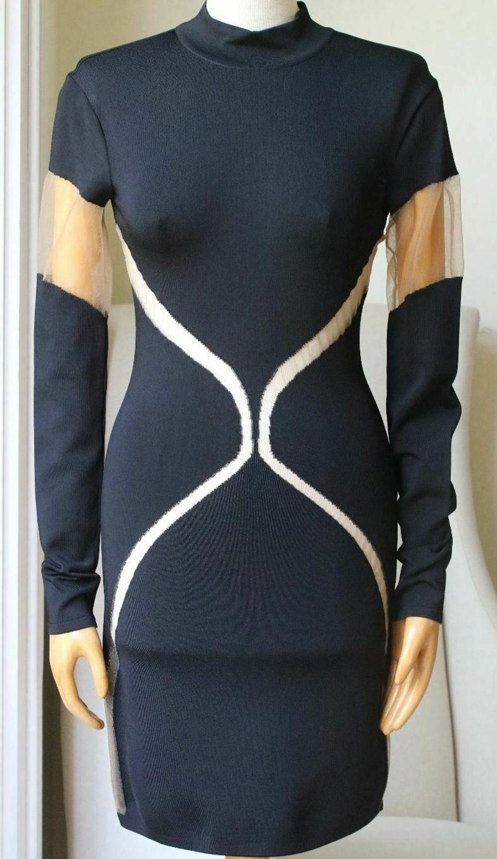 Balmain black and beige dress. Stretch-knit. Padded shoulders, tulle panels. Zip fastening along back. 99% Viscose, 1% polyamide.

Size: FR 38 (UK 10, US 6, IT 42)

Condition: As new condition, no sign of wear. 