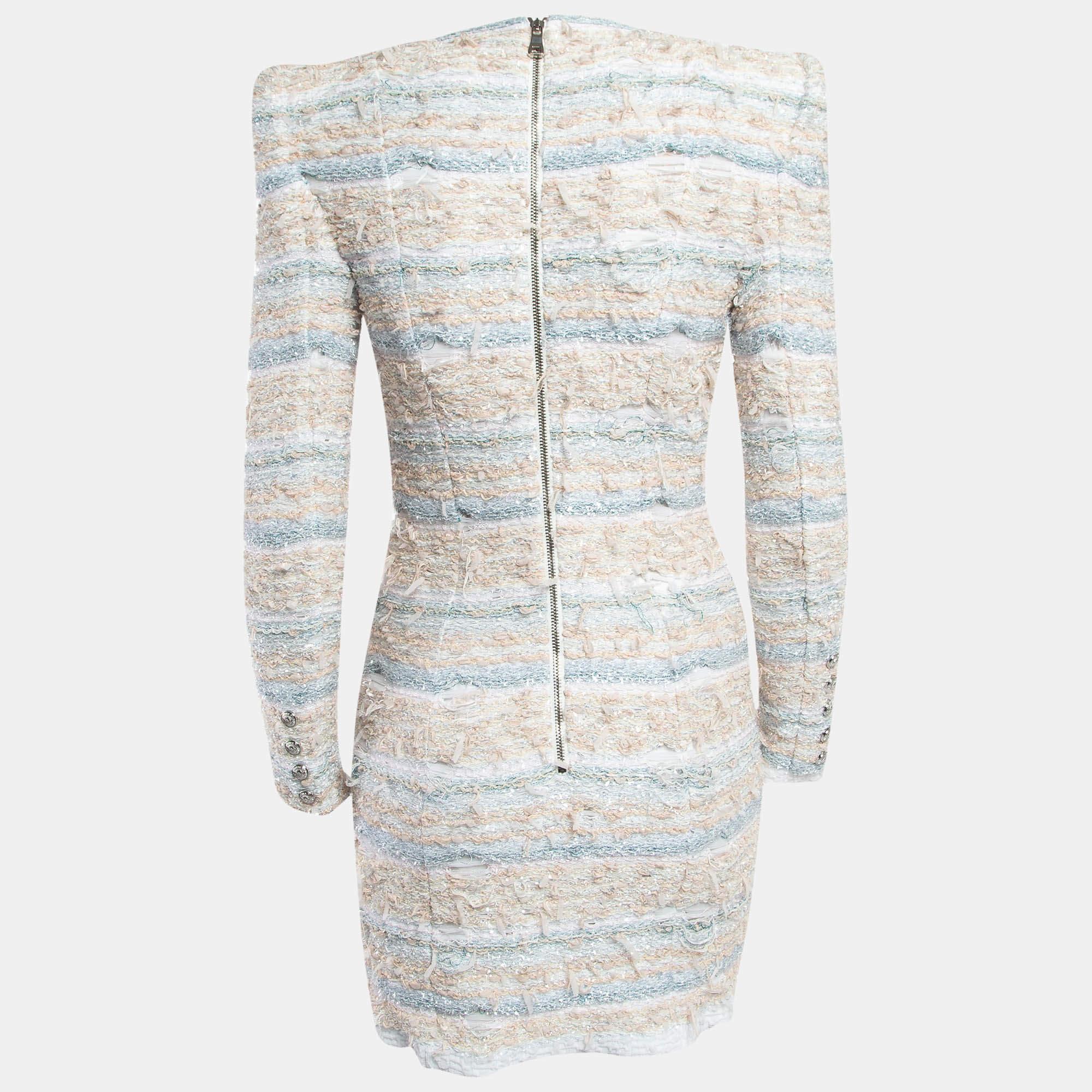 The fine artistry and the feminine silhouette of this Balmain dress exhibit the label's impeccable craftsmanship in tailoring. It is stitched using quality materials, has a good fit, and can be easily styled with chic accessories, open-toe sandals,