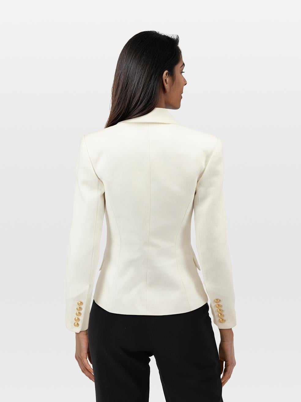CONDITION is Very good. Minimal wear to the jacket is evident. Discolouration around the back neck, both sleeves, facing of the front left opening and under the armpits on the lining on this used Balmain designer resale item. Discolouration may need