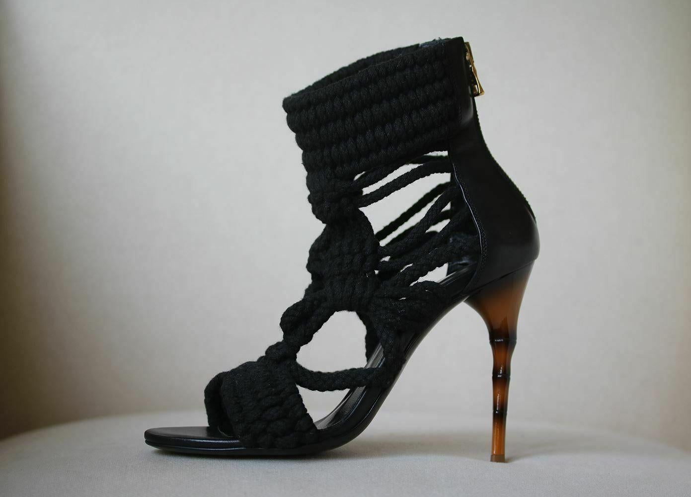 Black woven Balmain multistrap rope sandals with leather trim, resin heels and zip closures at counters. Heel measures approx. 4.25 inches. 

Size: EU 38 (UK 5, US 8)

Condition: Worn once. Slightest wear to the soles; see pictures. Otherwise, no