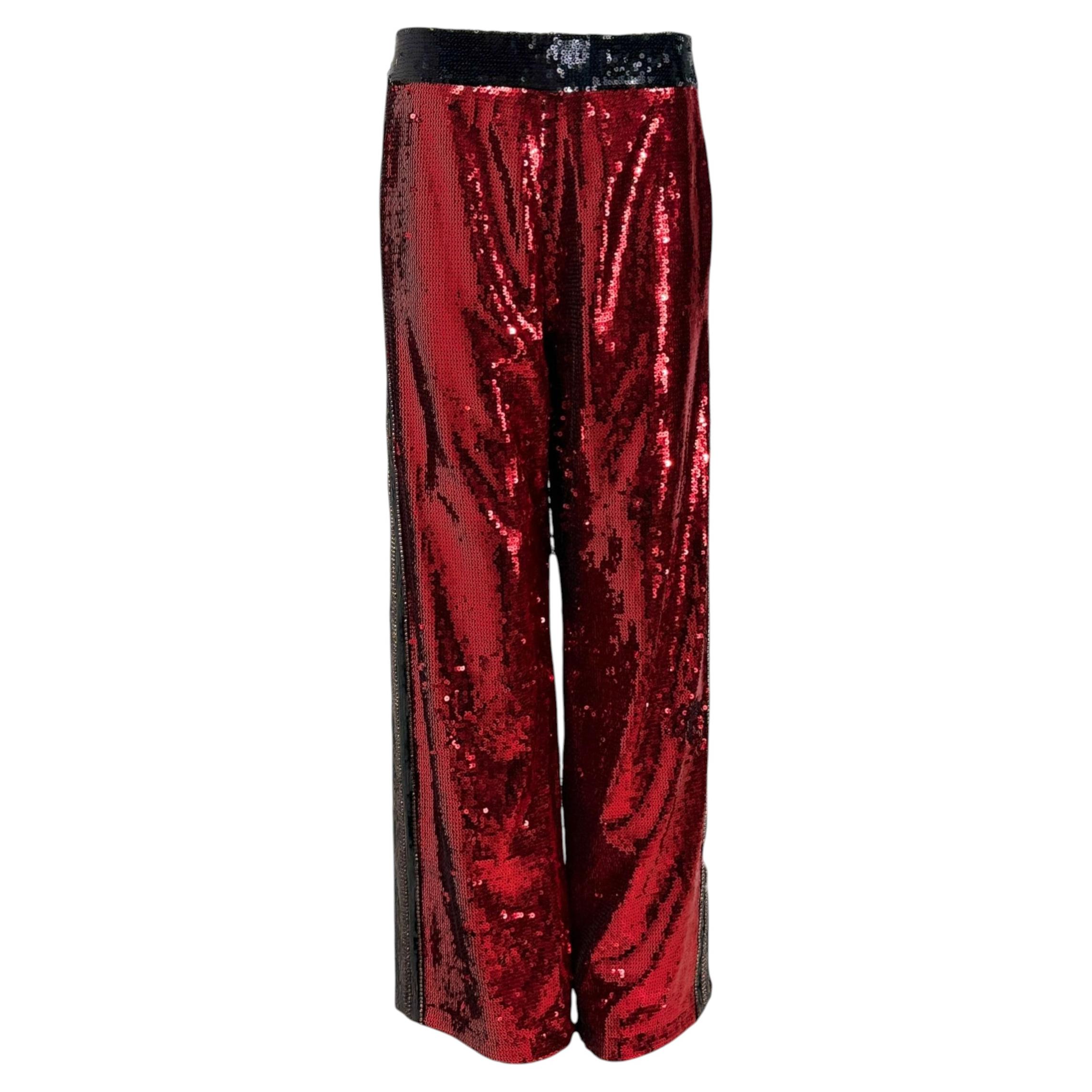 Who designs Balmain jeans?