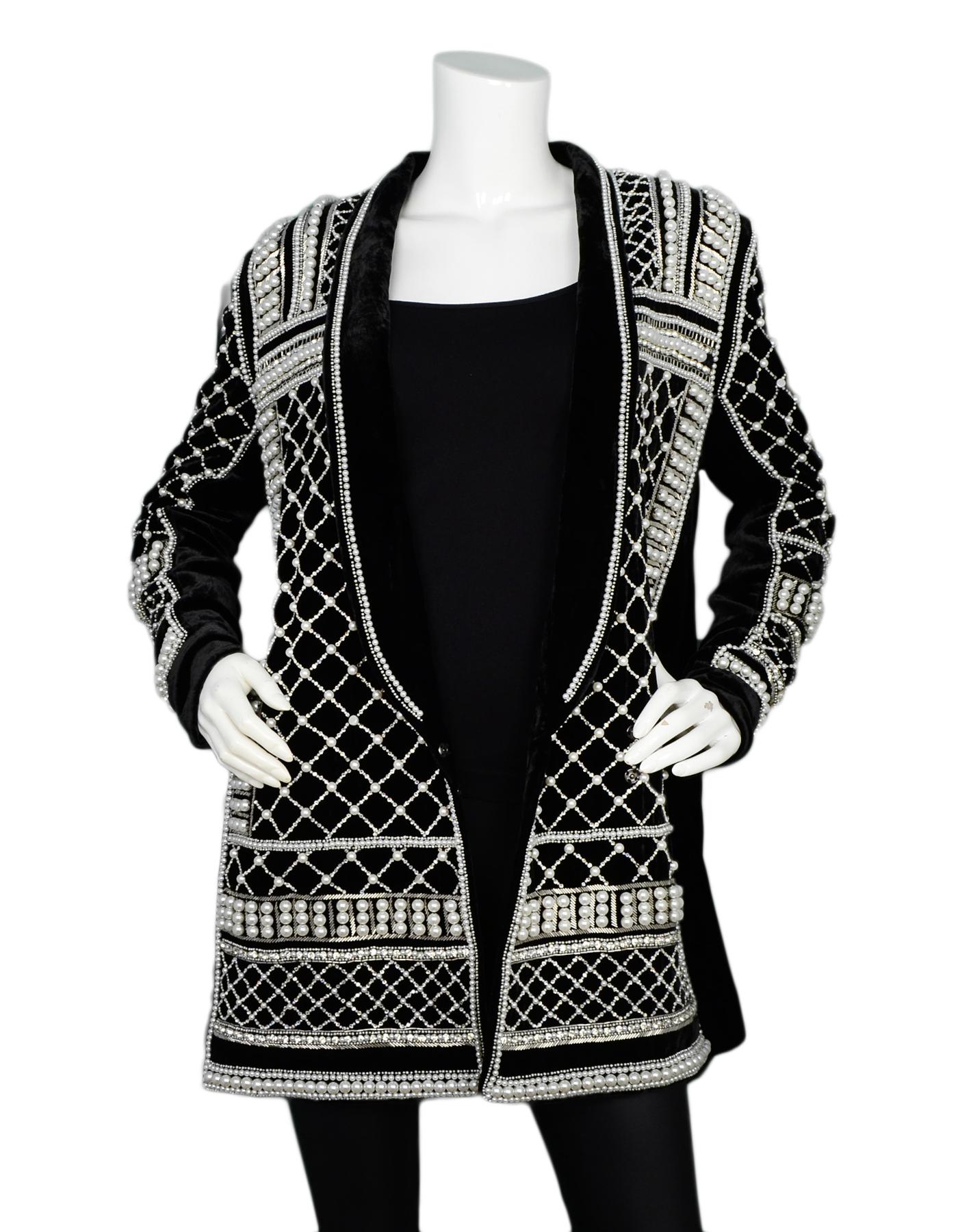 Balmain x H&M Black Velvet Pearl & Crystal Embellished Jacket Sz 10

Made In: India
Color: Black and white
Materials: 79% viscose, 21% silk
Lining: 100% viscose 
Opening/Closure: Double breasted snap closures at bottom 
Overall Condition: Excellent