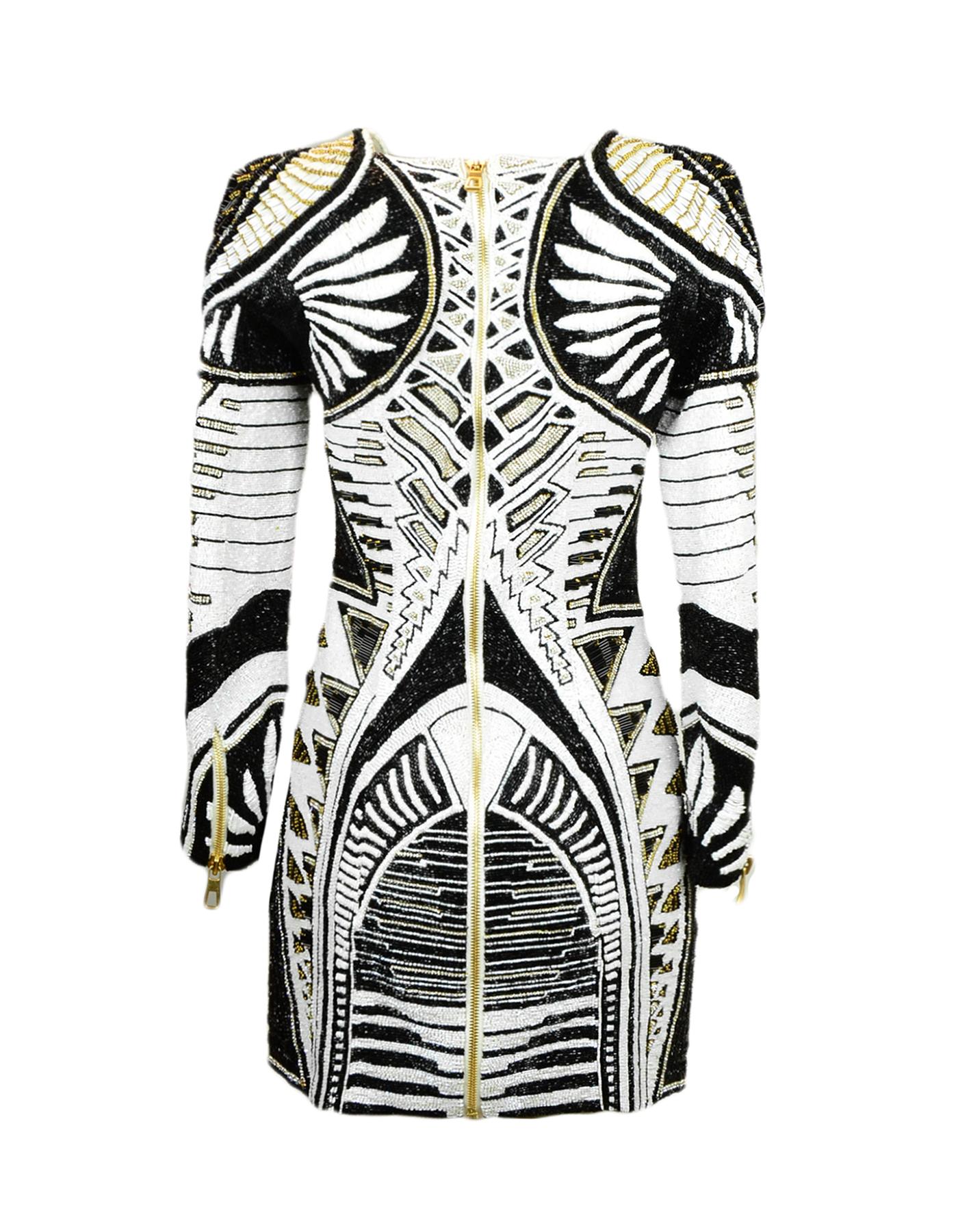 Limited Edition Balmain x H&M Black/White Beaded Longsleeve Mini Dress.  Features black and white beading with gold accents and crystals.
Made In: India
Color: Black, white, and gold
Materials: 100% polyester
Lining: 100% viscose
Opening/Closure: