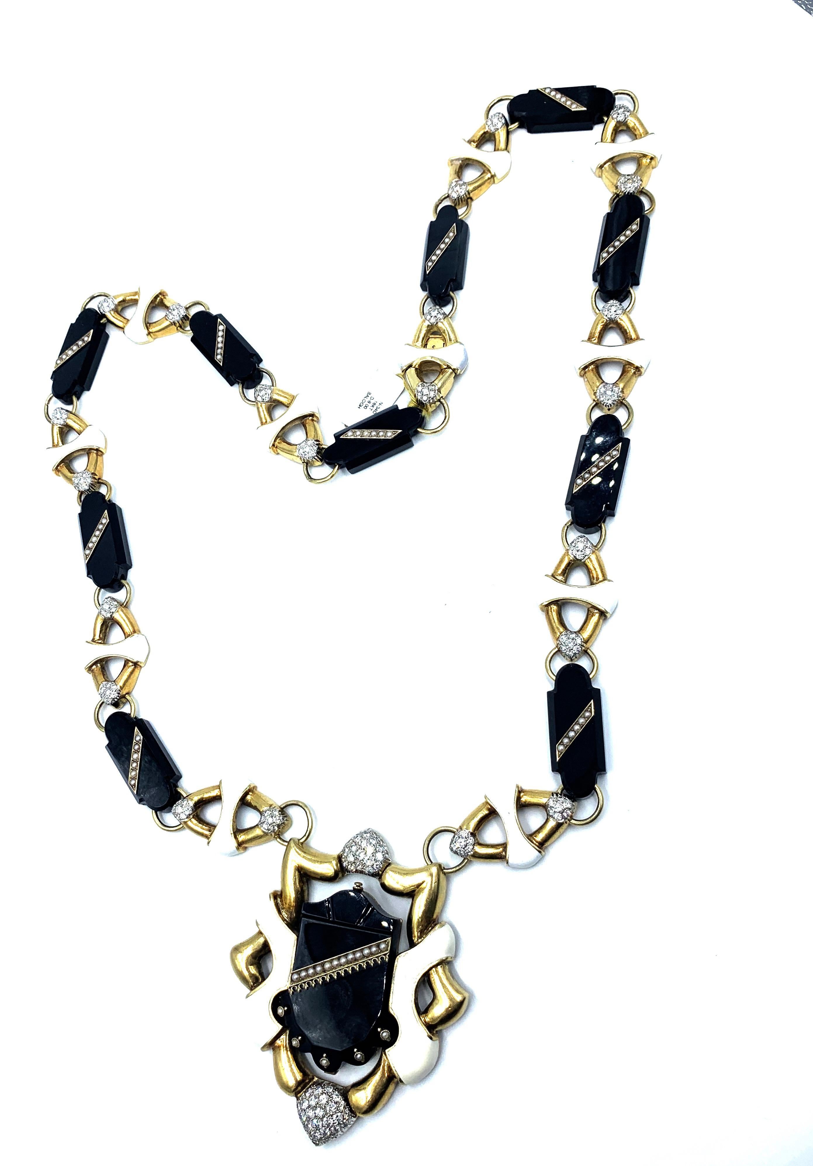 An impressive, long enamel diamond and onyx 18 kt yellow gold necklace from Balogh & Co Jewelers, Miami FL. The necklace has 8.00 carats of diamonds. The pendant is 3.25 in length, attached to a 31.5” necklace.