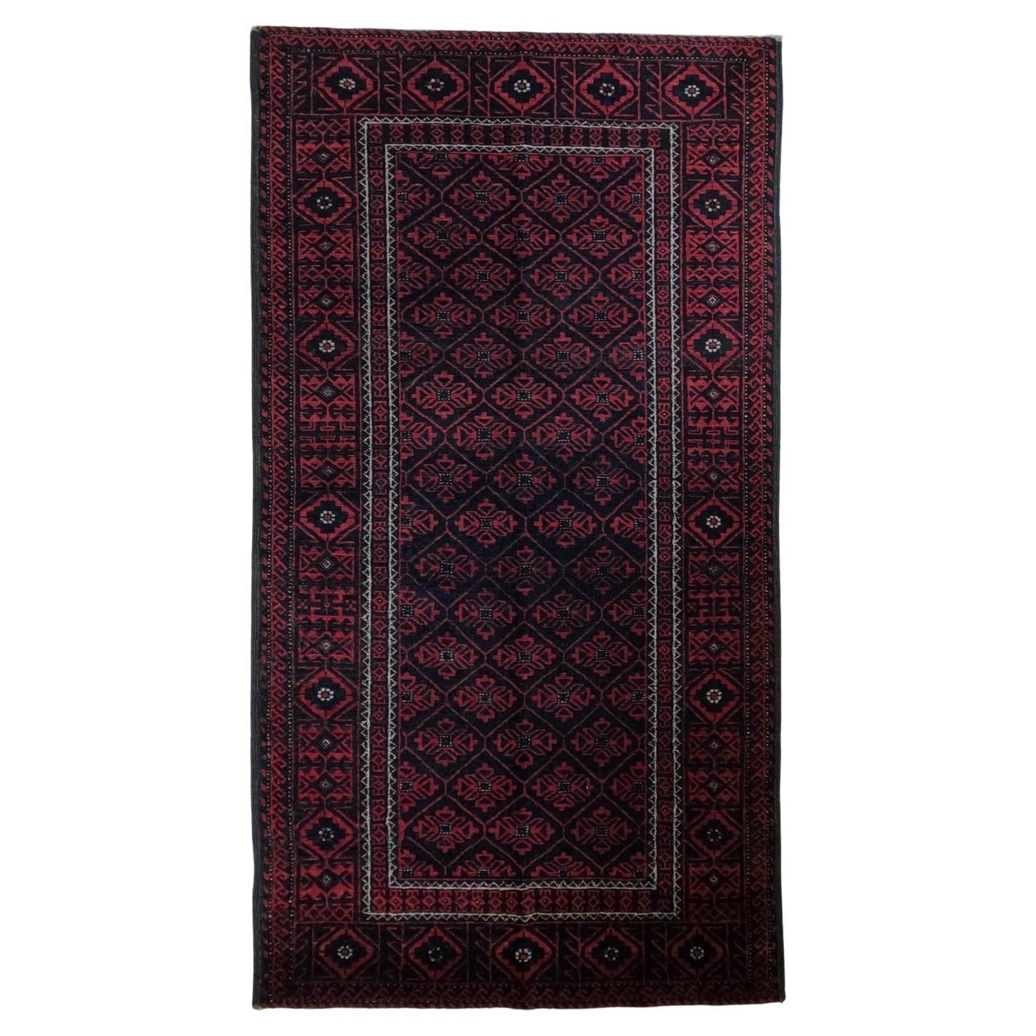 Balouchi red and black  Vintage Semi Antique carpet  mid 20th-century  For Sale