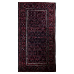 Balouchi red and black  Vintage Semi Antique carpet  mid 20th-century 