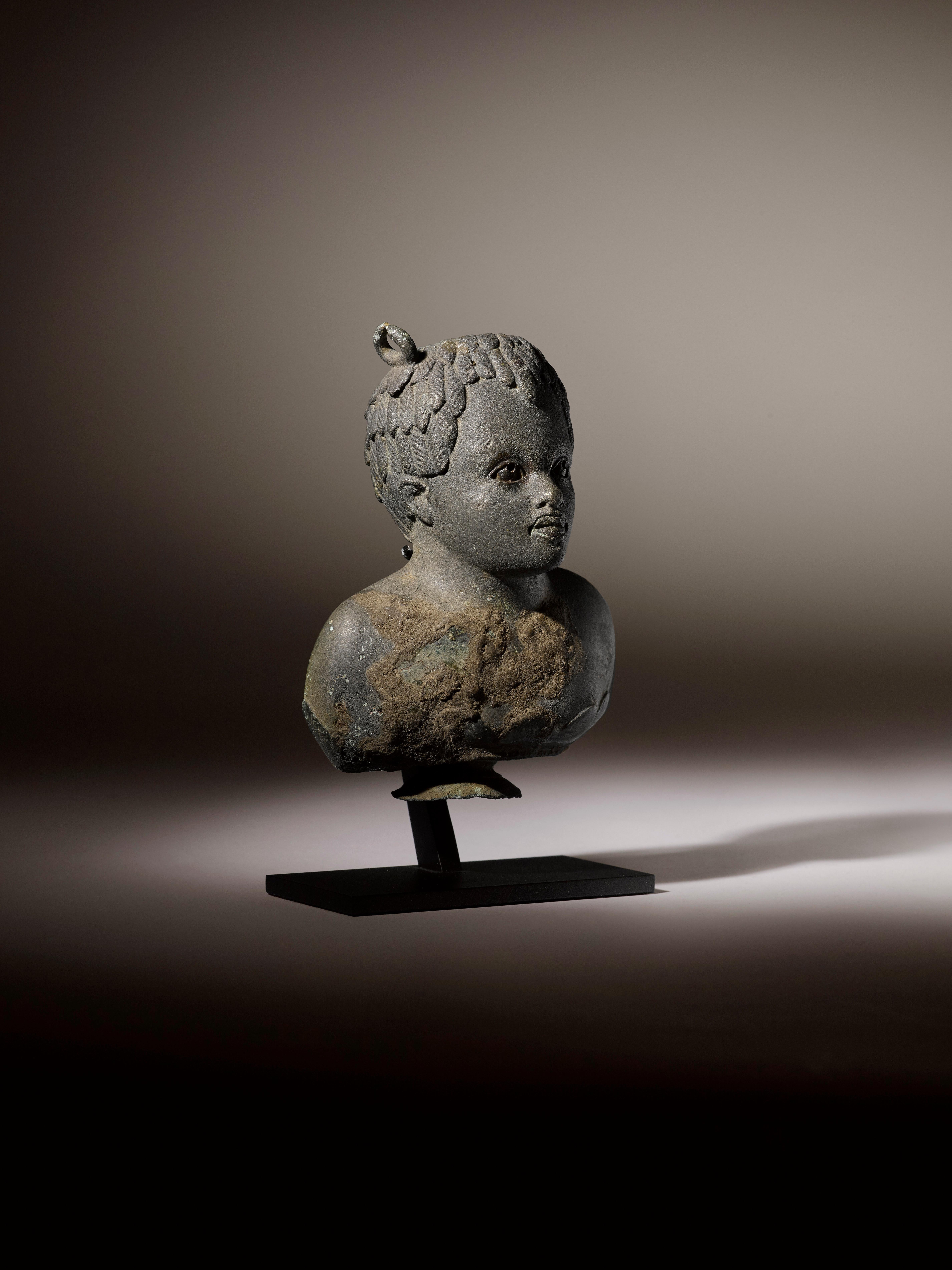 Balsamarium shaped as a Bust of a Black Boy

Bronze, silver inlaid eyes and lips, Roman, 1st – 2nd Century AD
Provenance:  
Private London Collection formed 1965-1975
 
H 10 cm (4 inch)

This exquisite Roman bronze balsamarium, dating from the 1st