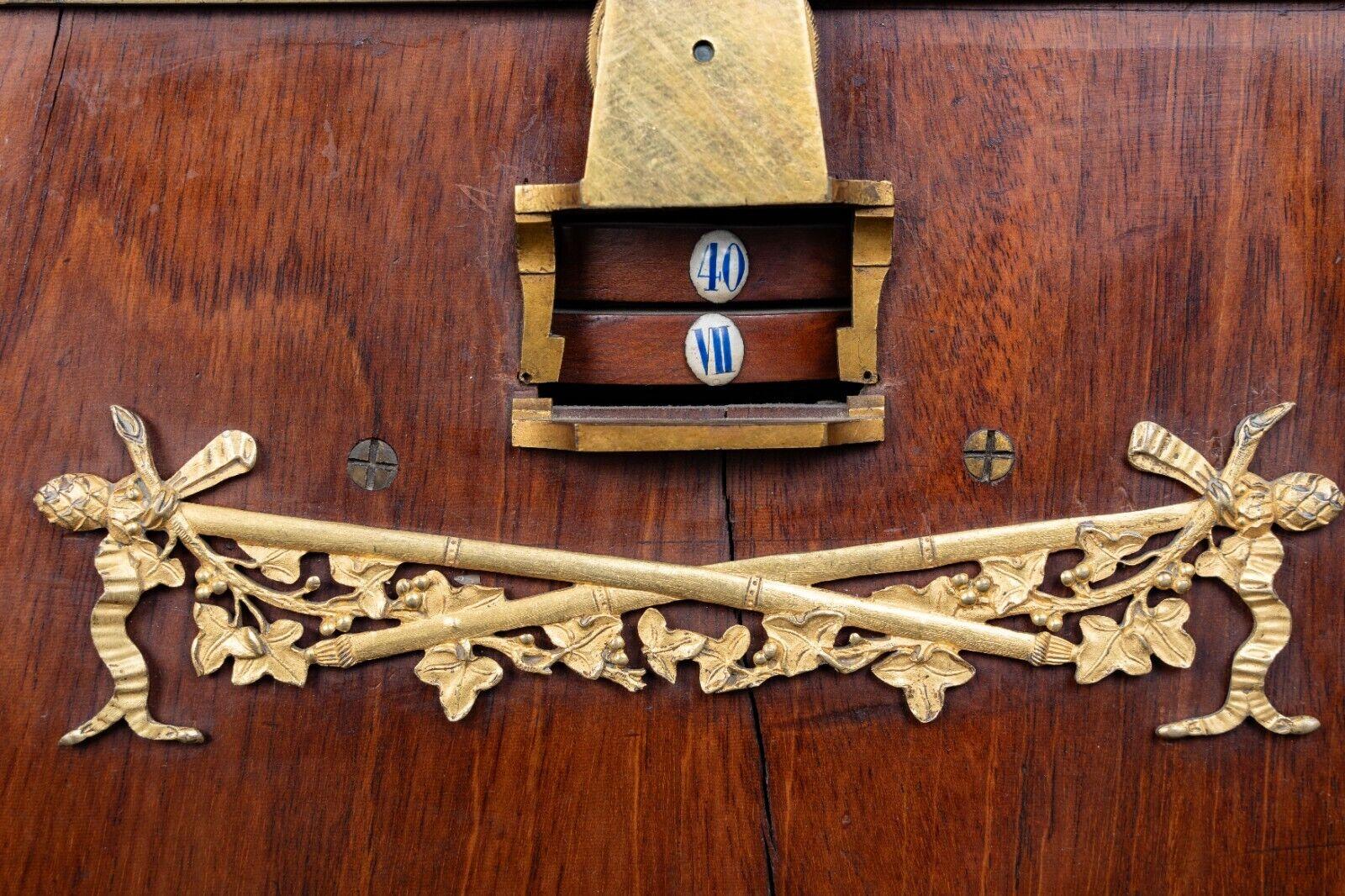 This is a 19th-century clock from the prestigious Balthazard firm in Paris. 

The first lyre clocks date back to the early 18th century. The lyre clock was very successful under Louis XVI, and this lot is derived from typical models that came in