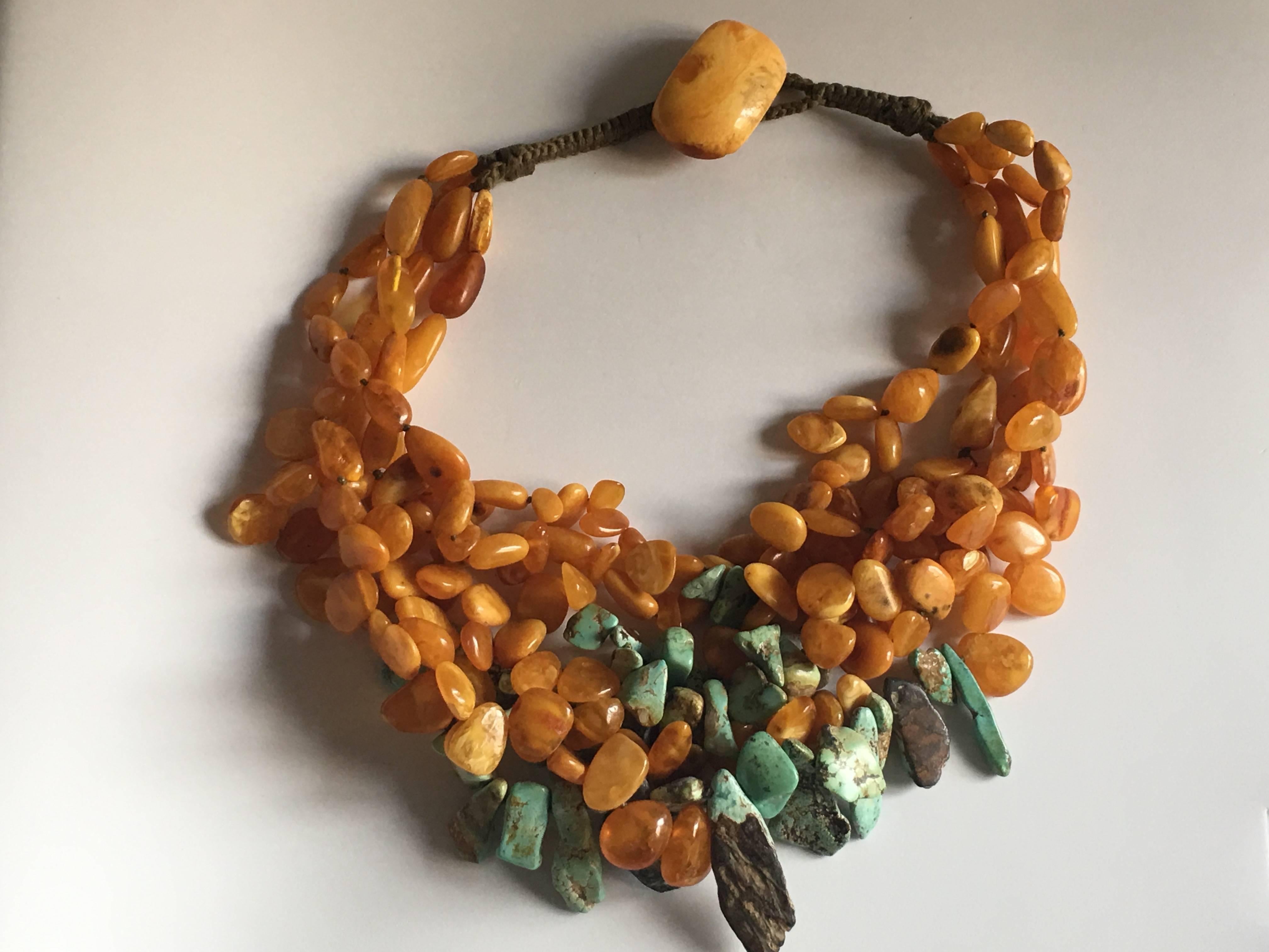 Necklace with antiques Baltic yellow amber irregular  beads, turquoise antiques drops.
Big button of amber ad a closure.
Total lenght 47cm.
All Giulia Colussi jewelry is new and has never been previously owned or worn. Each item will arrive at your