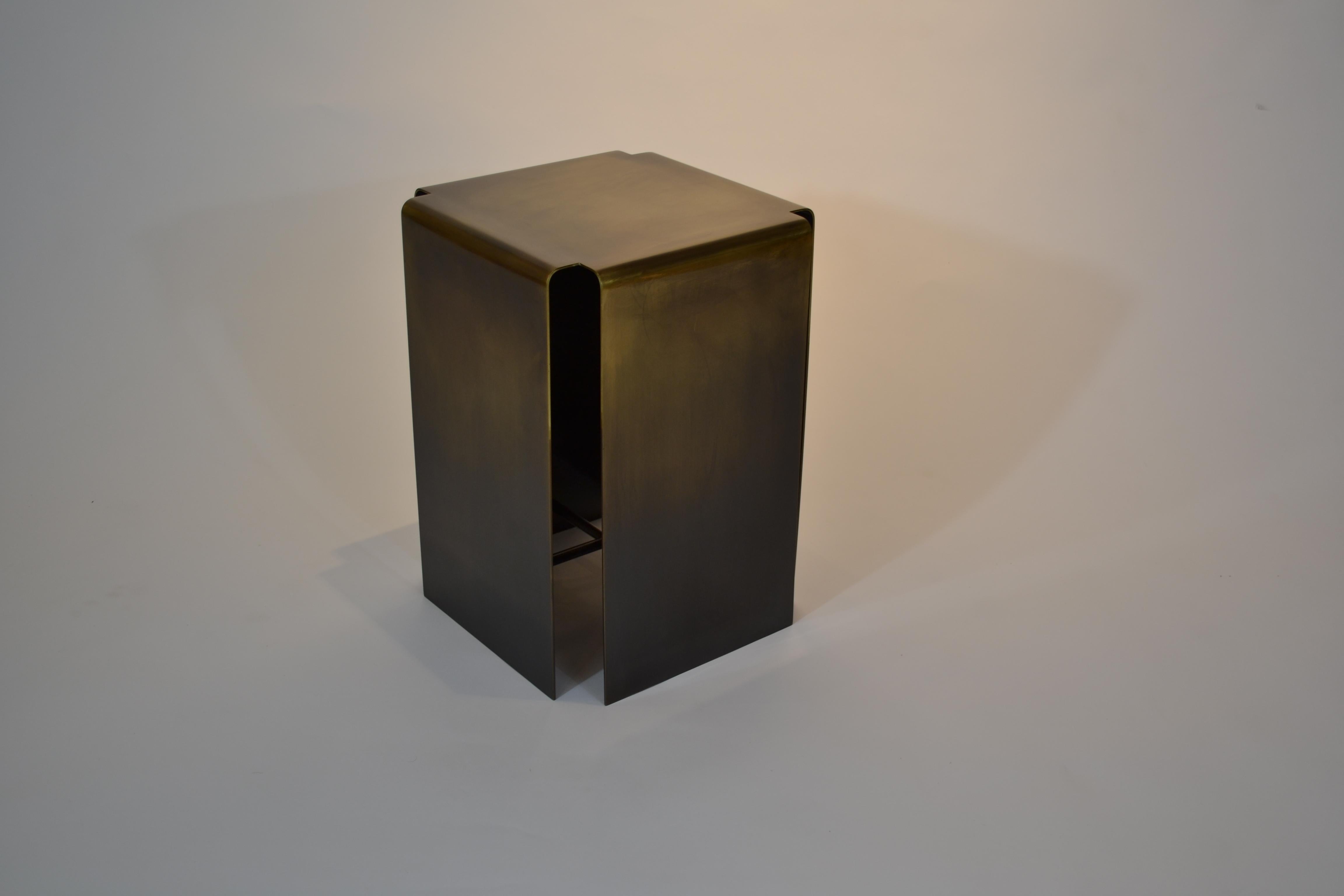 Baltic darkened bronze side table by Gentner Design
Dimensions: D 33 x W 33 x H 48 cm
Materials: darkened bronze
Available in lightened bronze and darkened bronze. 

The Baltic embodies a conceptual design that is striking in its simplicity;
