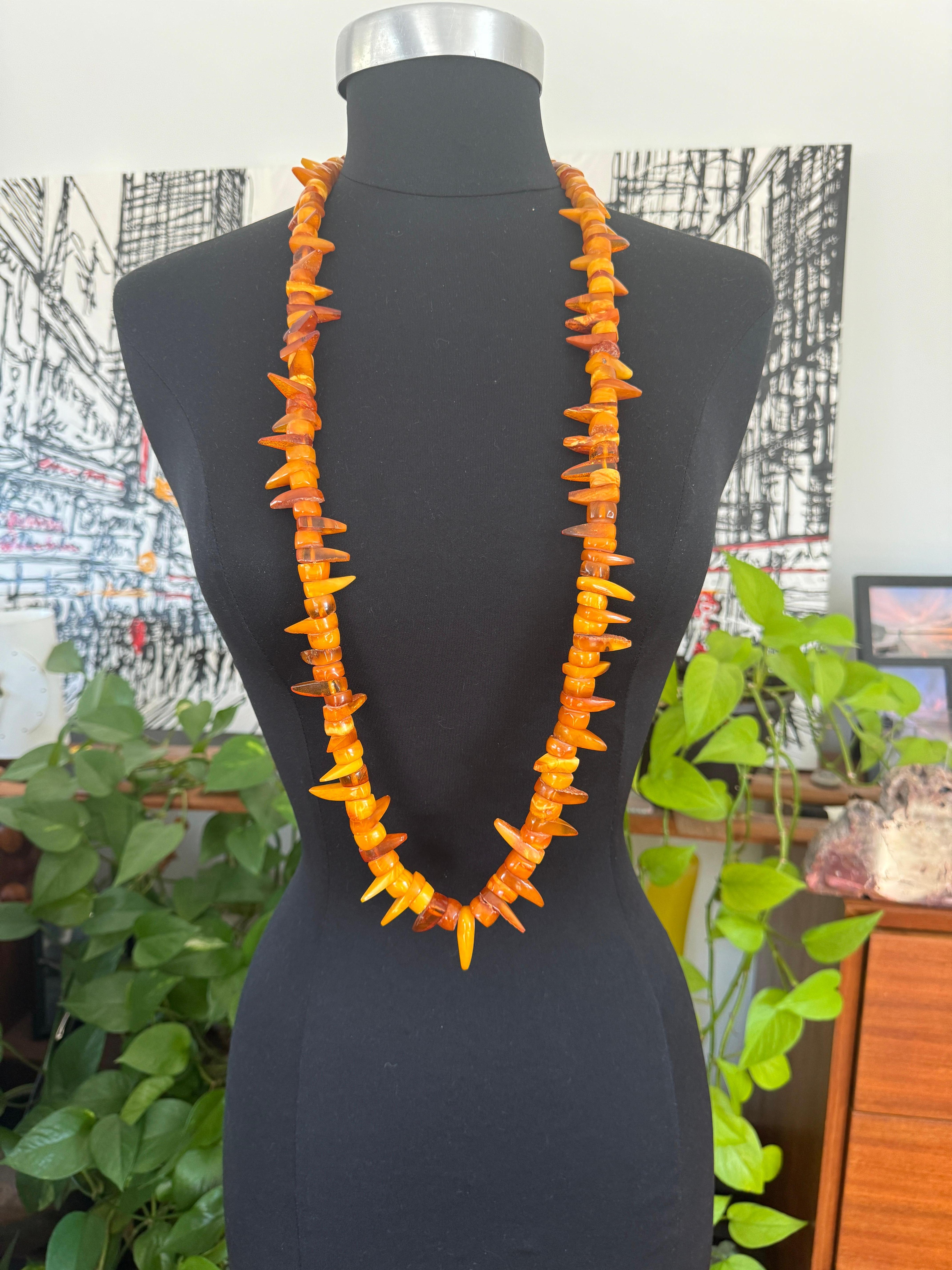Both disc and elongated pieces of amber are strung together 
Long Necklace amber
AMBER is between 30 - 90 million years old
Measuring 
41