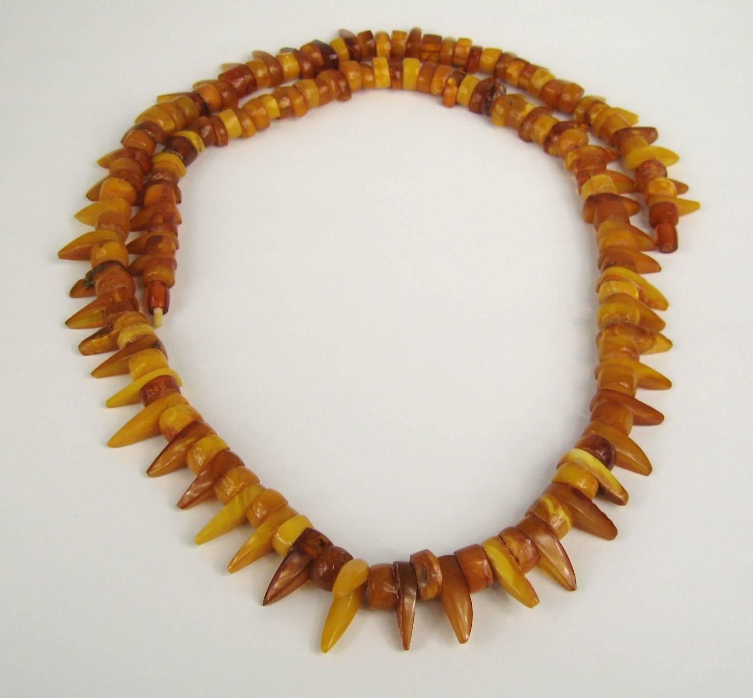 Both disc and elongated pieces of amber are strung together 
Long Necklace amber
AMBER is between 30 - 90 million years old
Measuring 
41