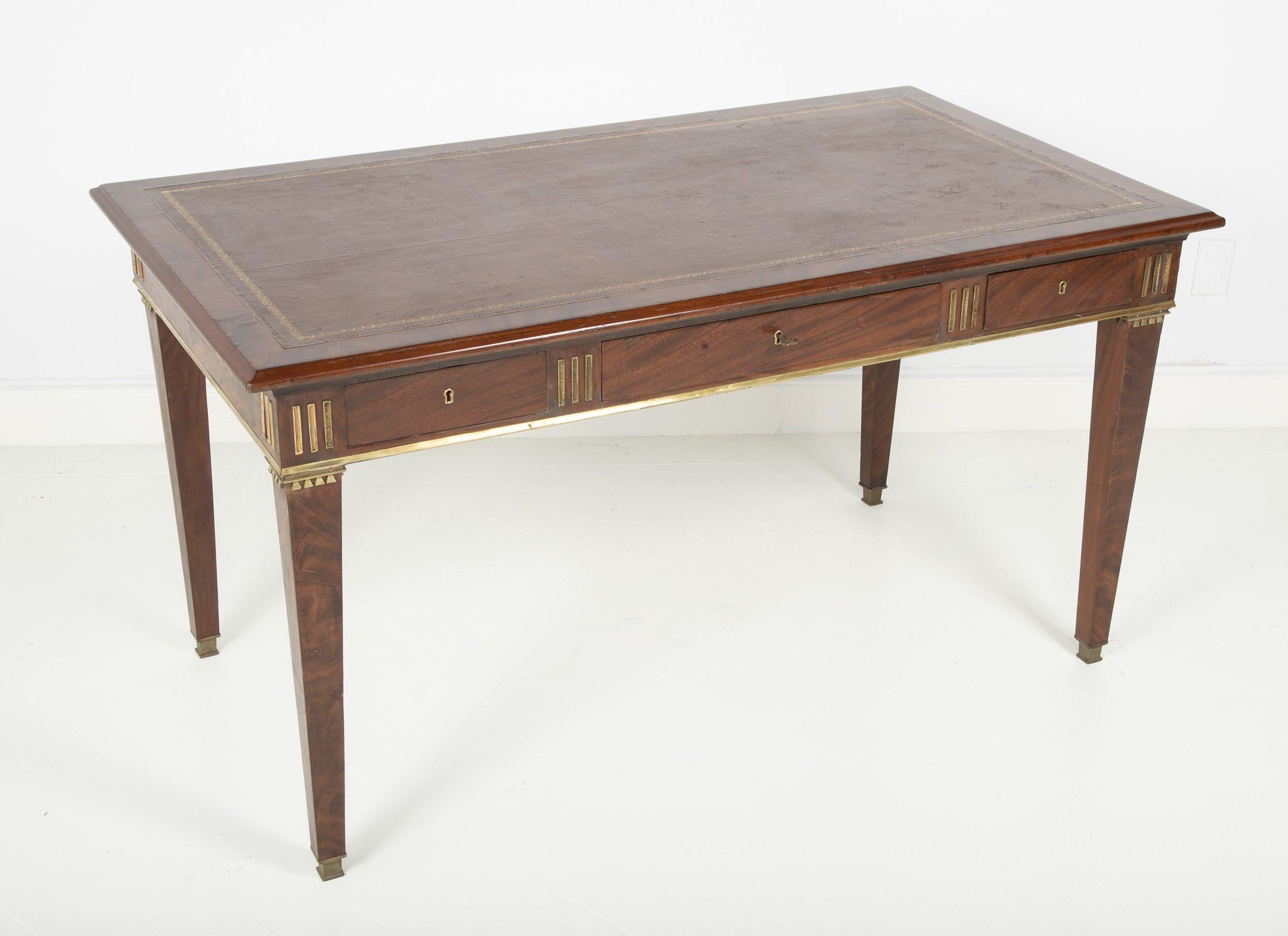A Baltic mahogany leather top and brass fluted writing table with three frieze drawers on square bronze mounted tapering legs.


We are proud of our long-standing partnership with George N Antiques who specializes in fine authentic antique furniture