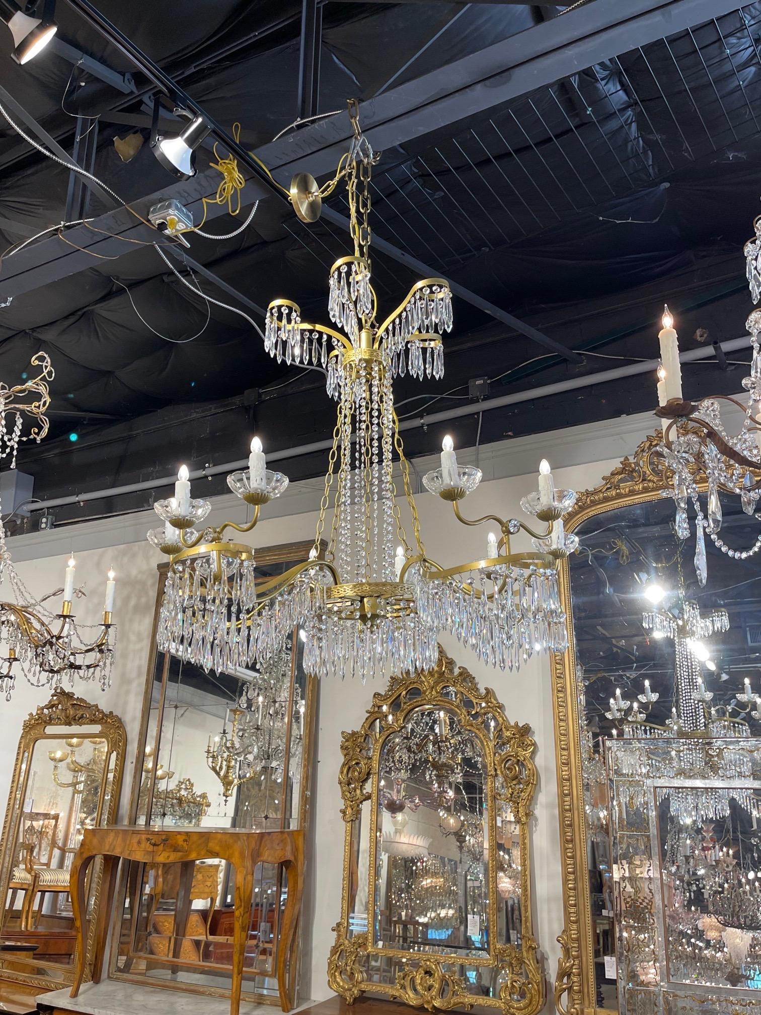 Large scale Baltic Neo-Classical crystal and gilt metal light chandelier. Interesting scale and shape on this fixture along with gorgeous crystals. Very elegant!!.