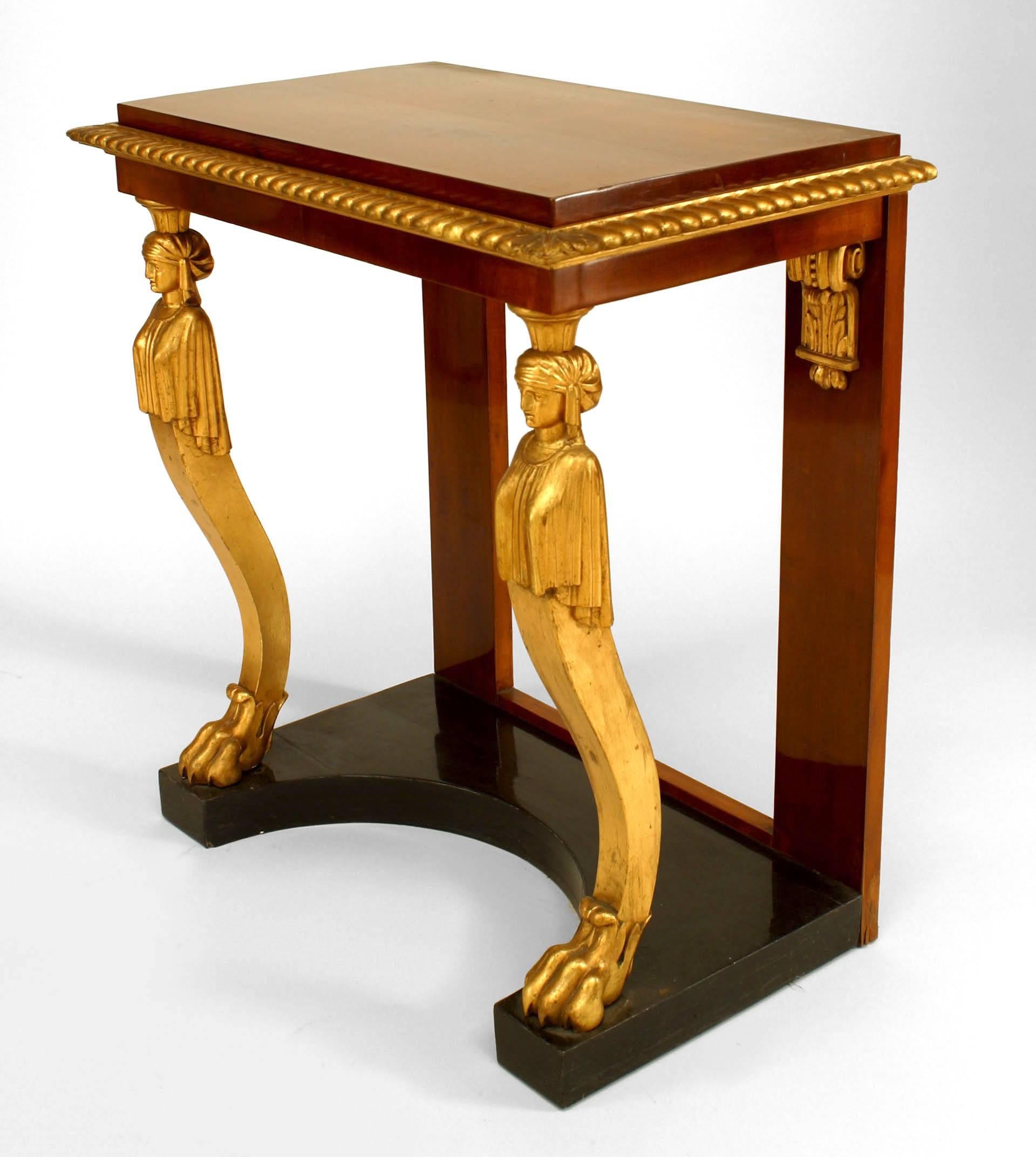 Baltic Neoclassic (1st Quarter 19th Century) parcel gilt, ebonized & mahogany console table with lion paw caryatid figures
