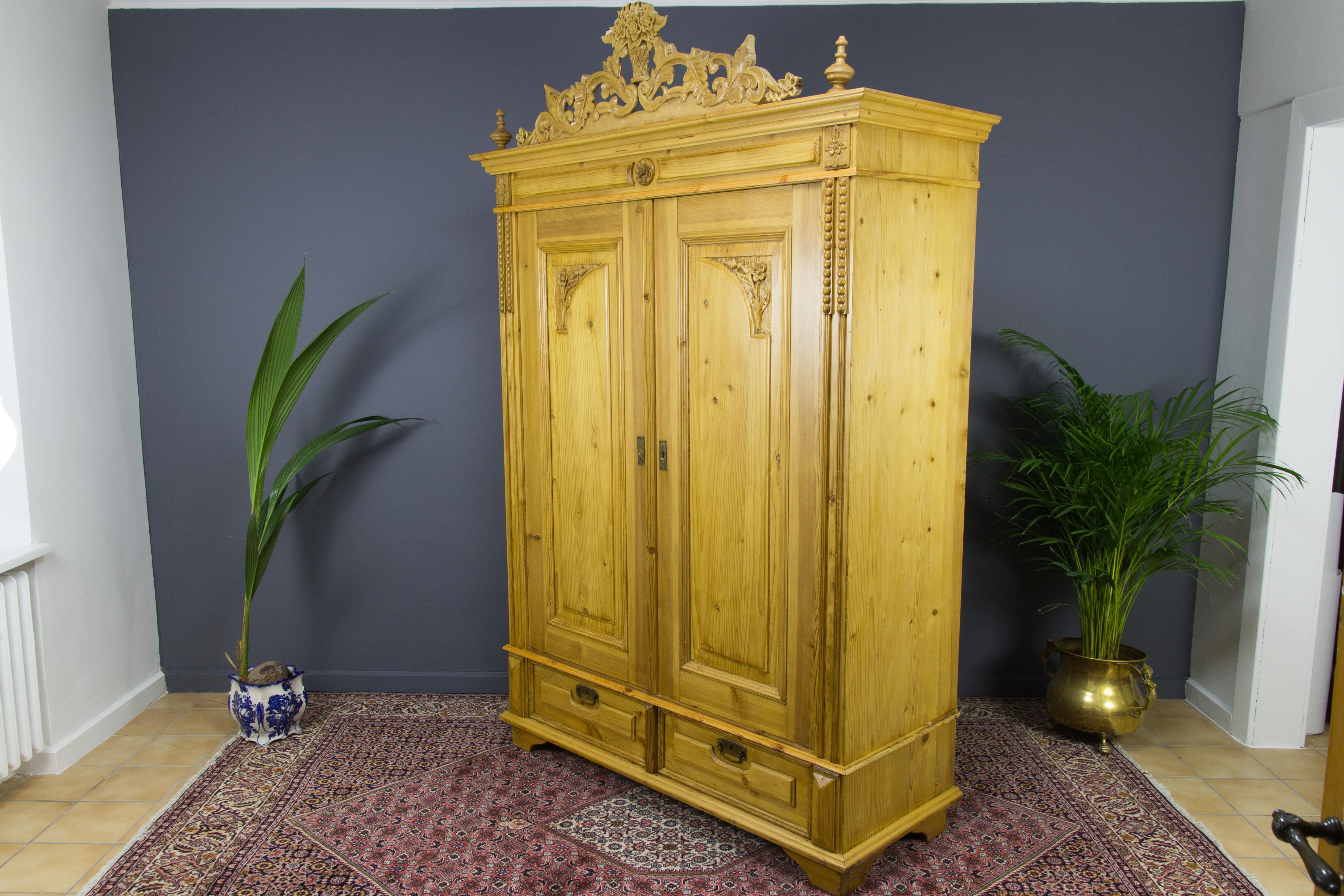 Baltic Pine Two-Door Armoire with Carved Flower Crown, 1920s 1