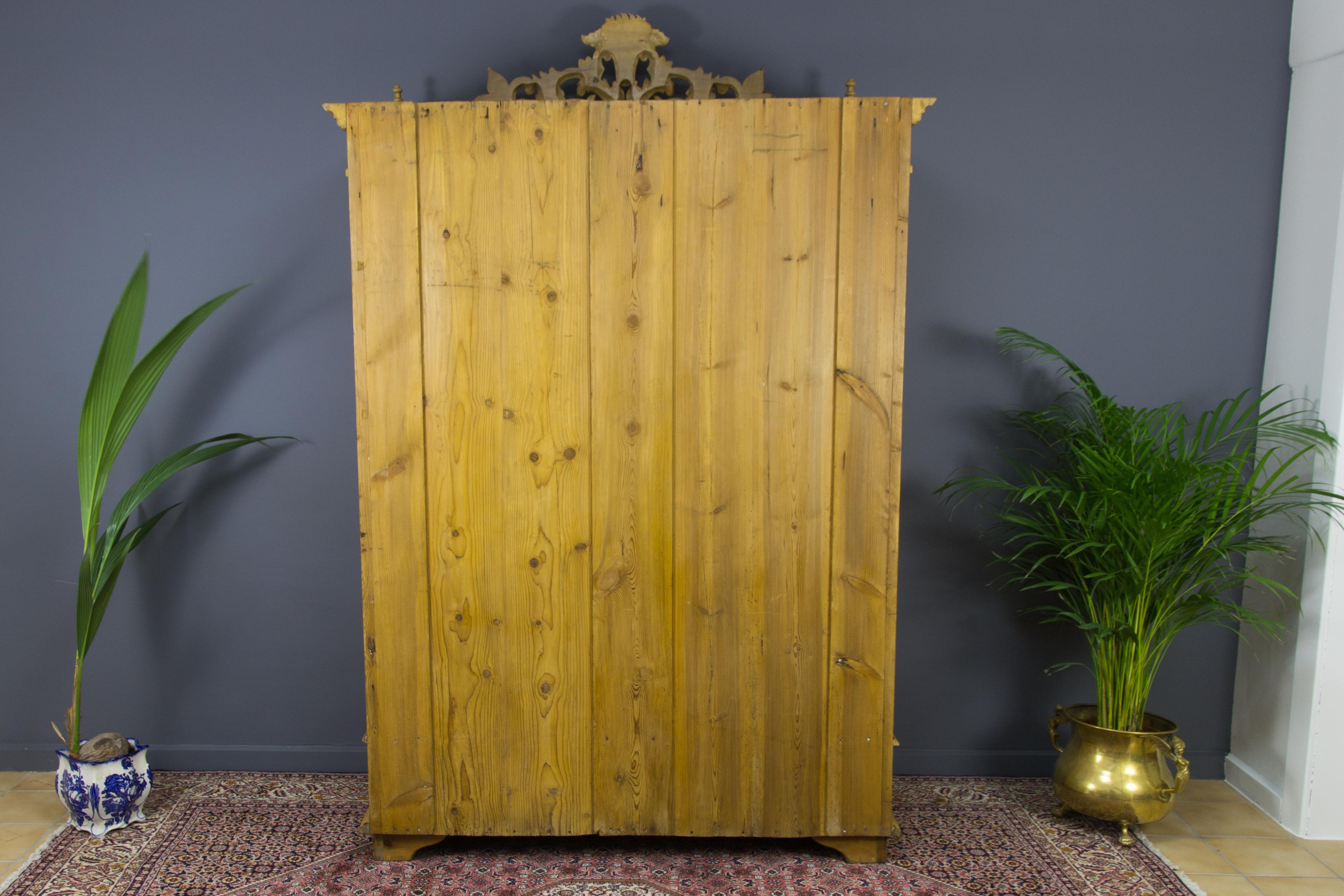 Hand-Carved Baltic Pine Two-Door Armoire with Carved Flower Crown, 1920s For Sale