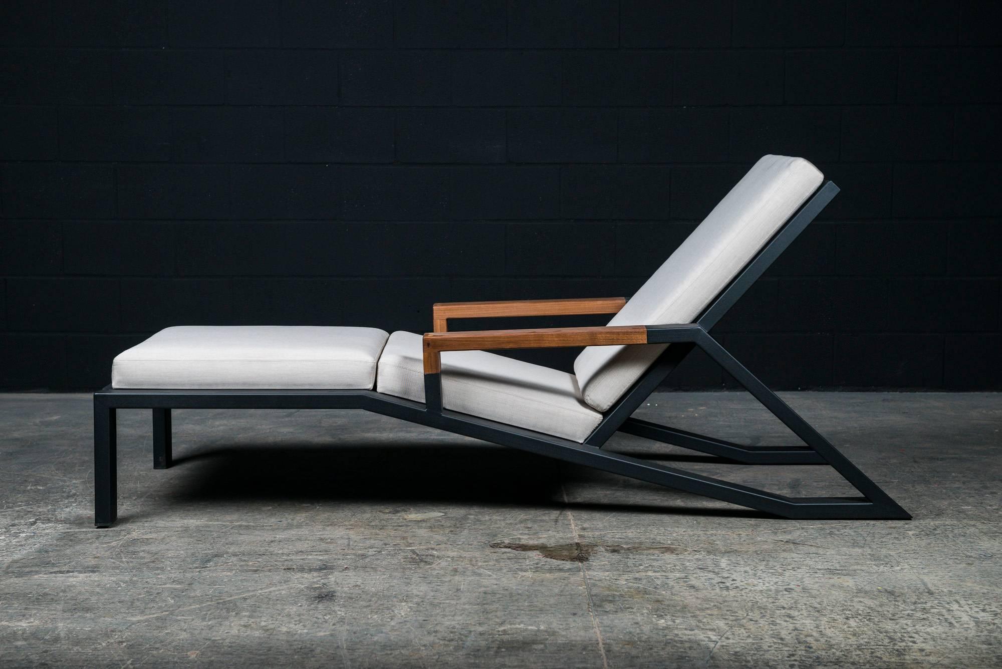 The Baltimore modern lounge chair is handmade to order from our unique Ambrozia black textured steel tubing frame design with a backchair in solid wood slats and wooden arms. Stainproof & UV resistant upholstery in beige Sunbrella fabrics. Offering