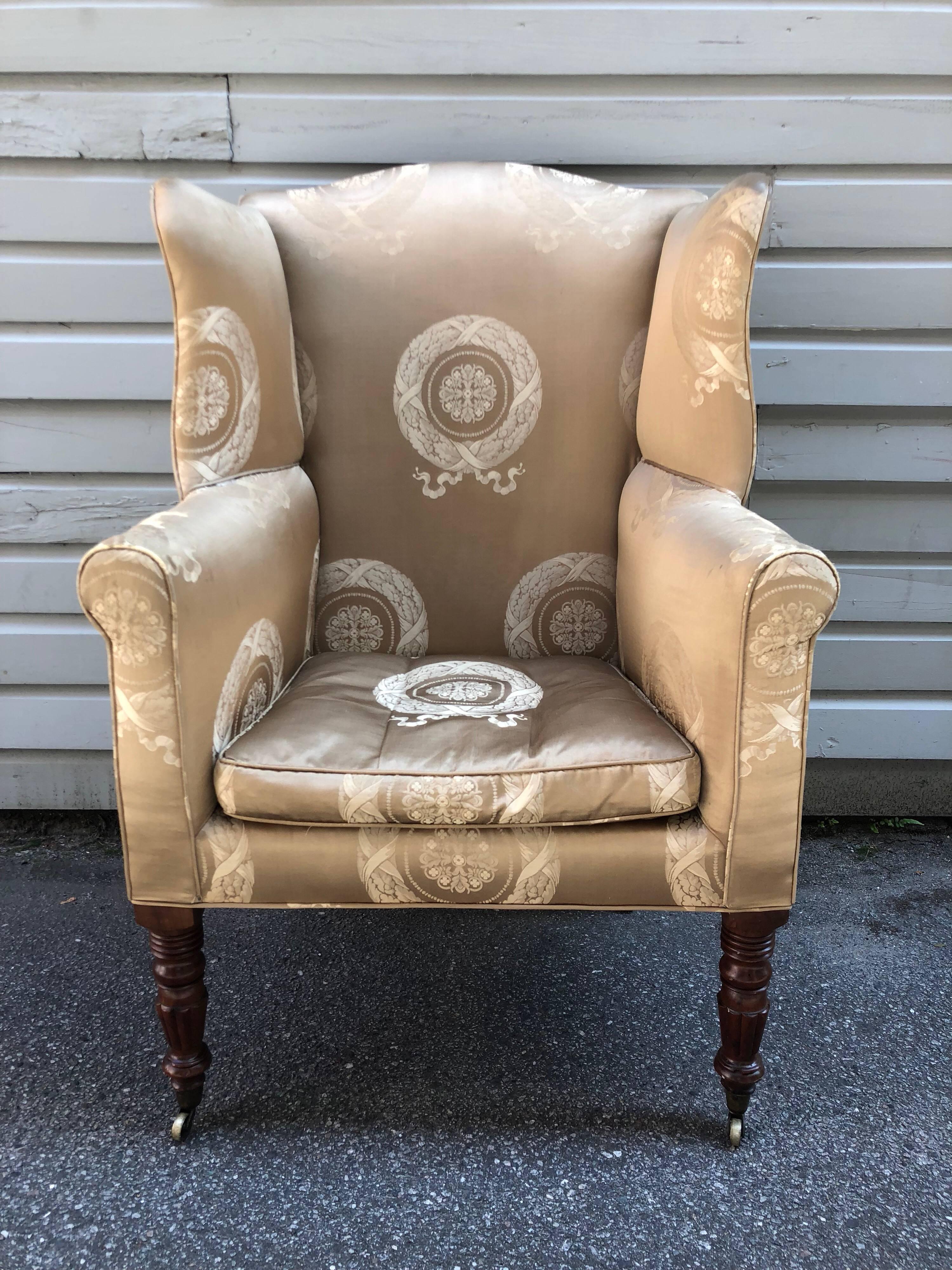 American wingback chair, attributed to Baltimore, mahogany turned and reeded legs, original casters, 1800-1815.