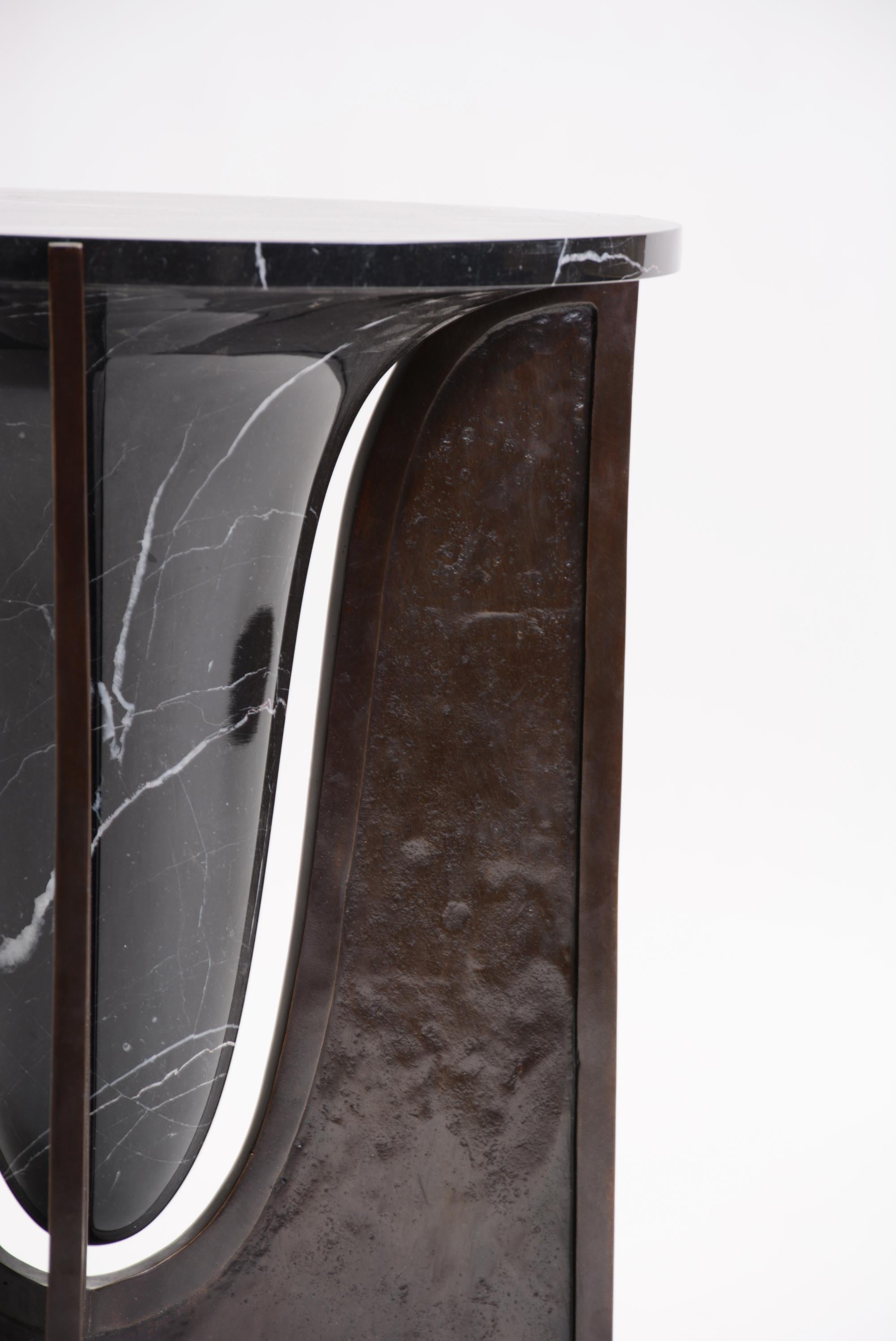 AVAILABLE NOW AND READY TO SHIP! / OR PICK-UP FROM CALIFORNIA

Baltoro is a sculptural side table with a centerpiece of solid black marble encapsulated by a textural cast bronze base. 

The name comes from the Baltoro Mountain range known for its