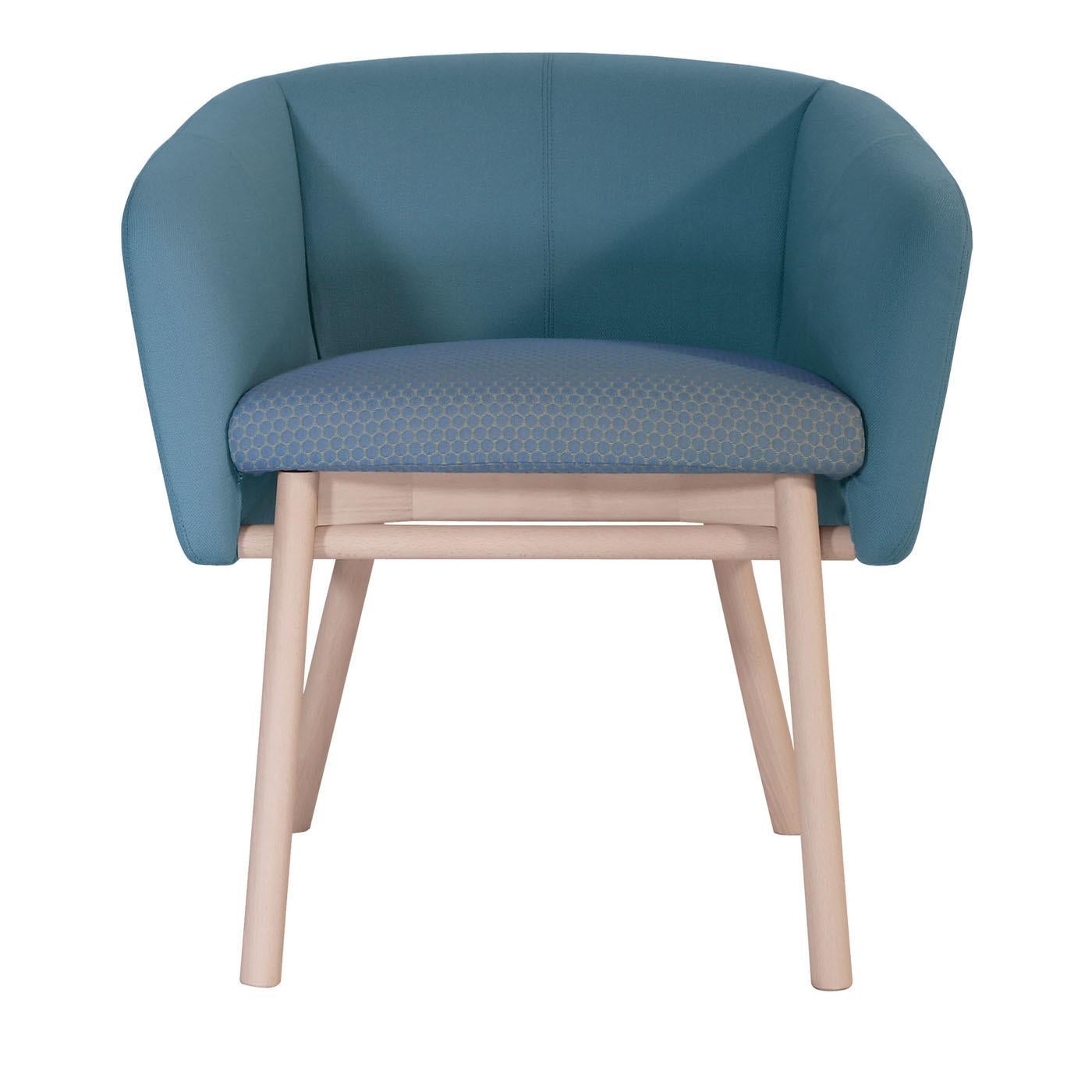 This unique chair is reminiscent of the traditional tub chair, with welcoming and embracing back and armrests and extremely comfortable seat. Its clean and elegant design is marked by a structure fashioned of bleached beechwood with slanted legs,