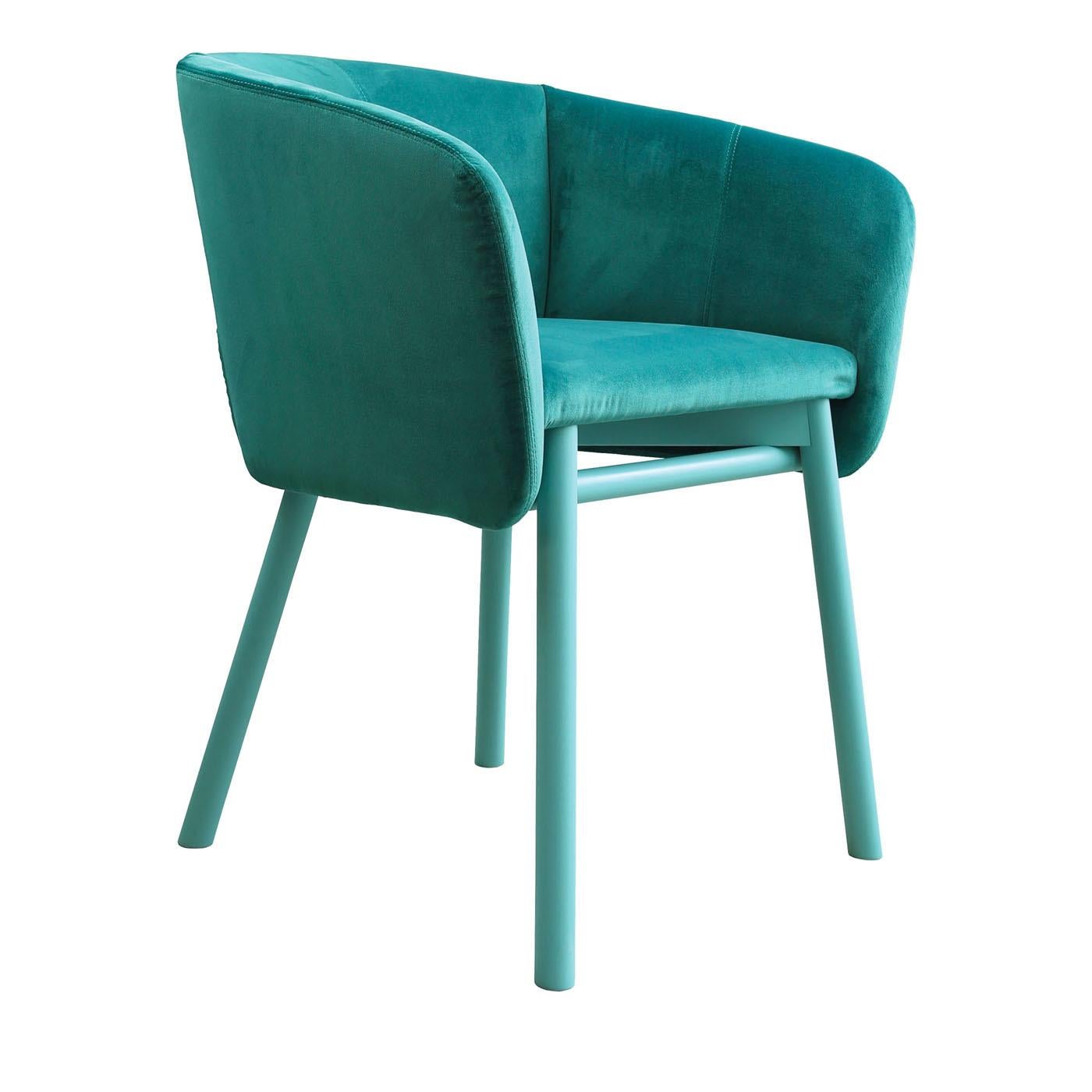 A modern interpretation of the traditional tub chair, this piece is an elegant and comfortable piece of functional decor. It boasts an interlocking structure with slanted legs made of beechwood and lacquered in emerald green, the same color covering