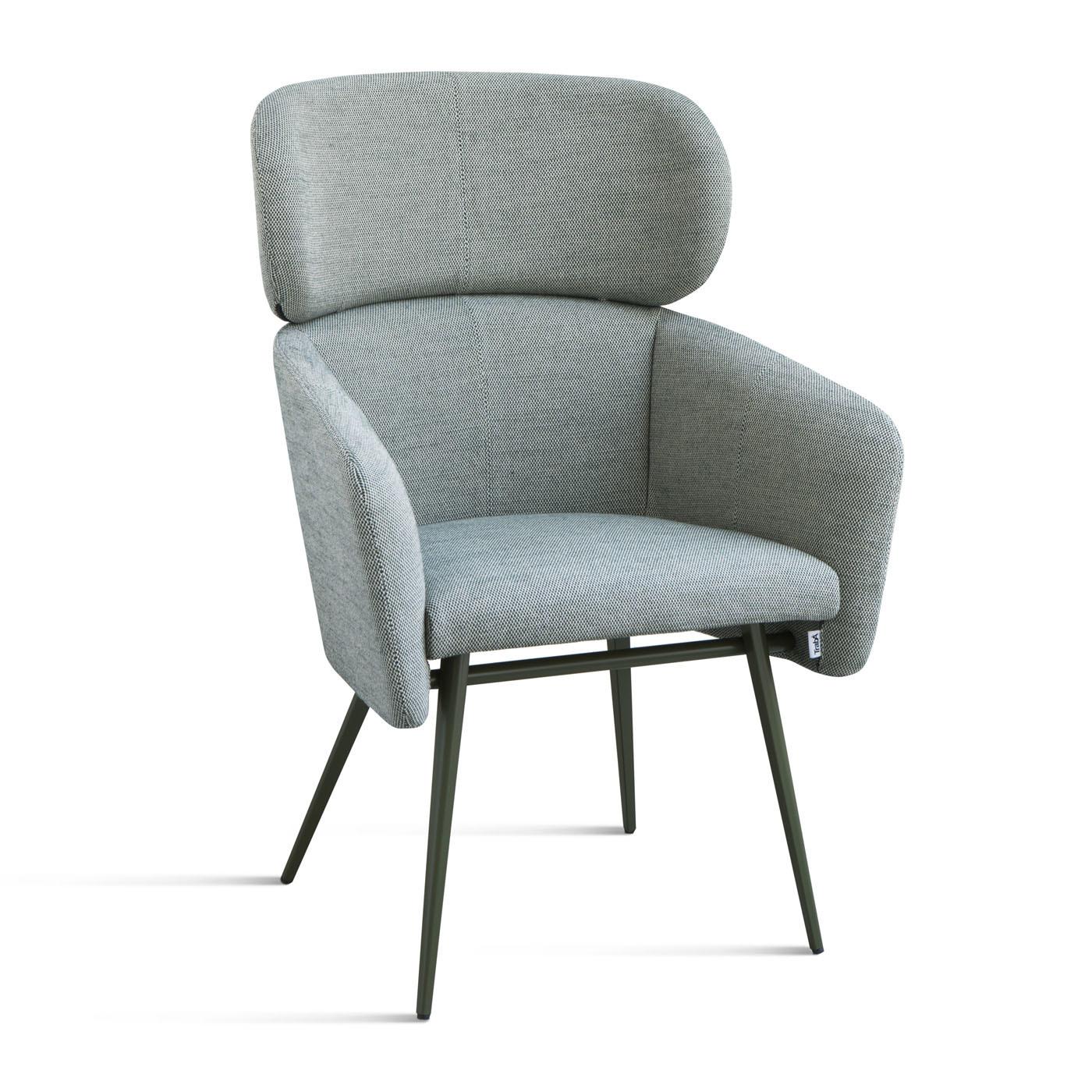 A perfect example of refined craftsmanship, this striking chair exudes comfort and sophistication. A larger version of the Balù chair designed by Emilio Nanni, it features a beechwood structure with slanted legs, and a seat and tall, enveloping back