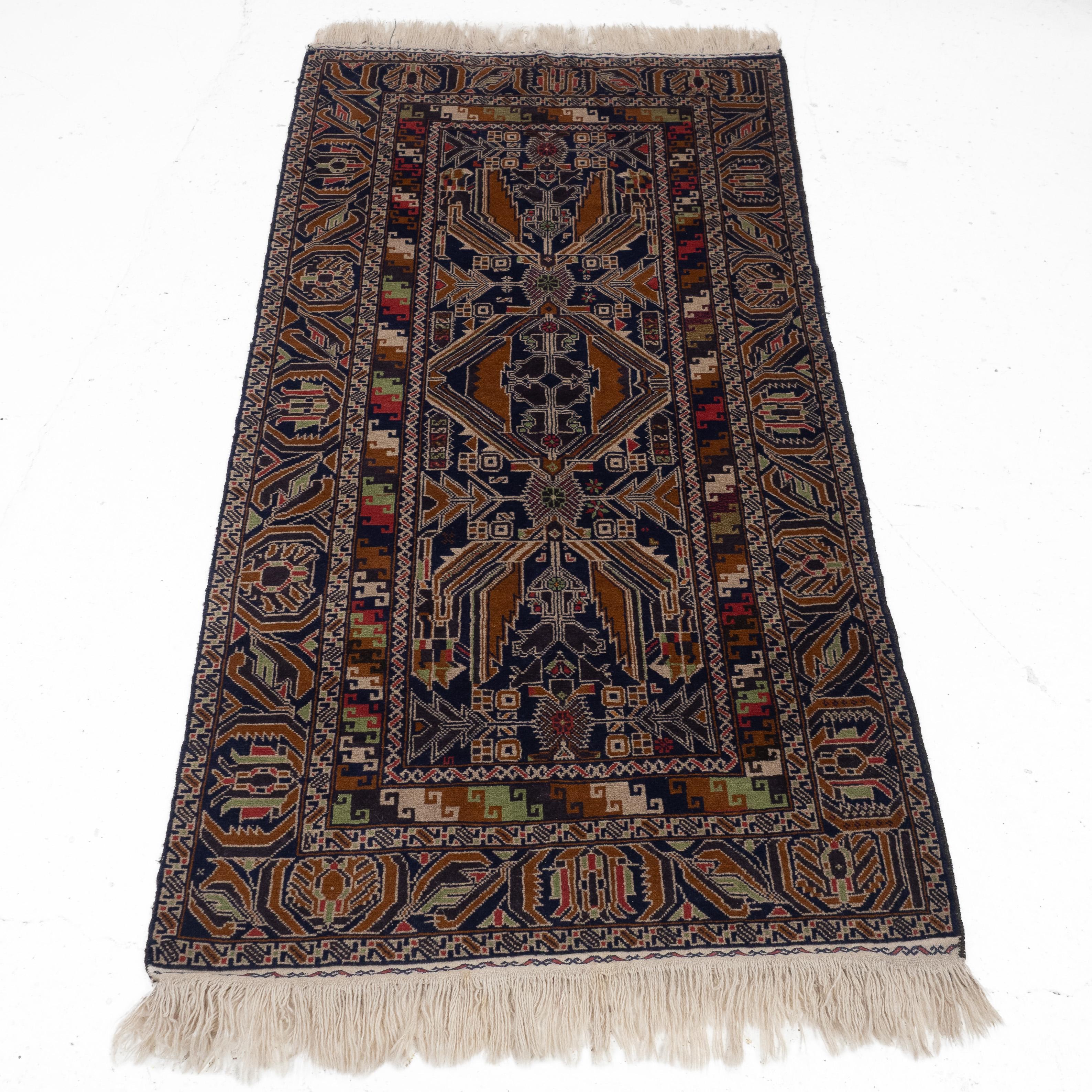 A Baluchi Afghan / Persian rug, approximately 7'6