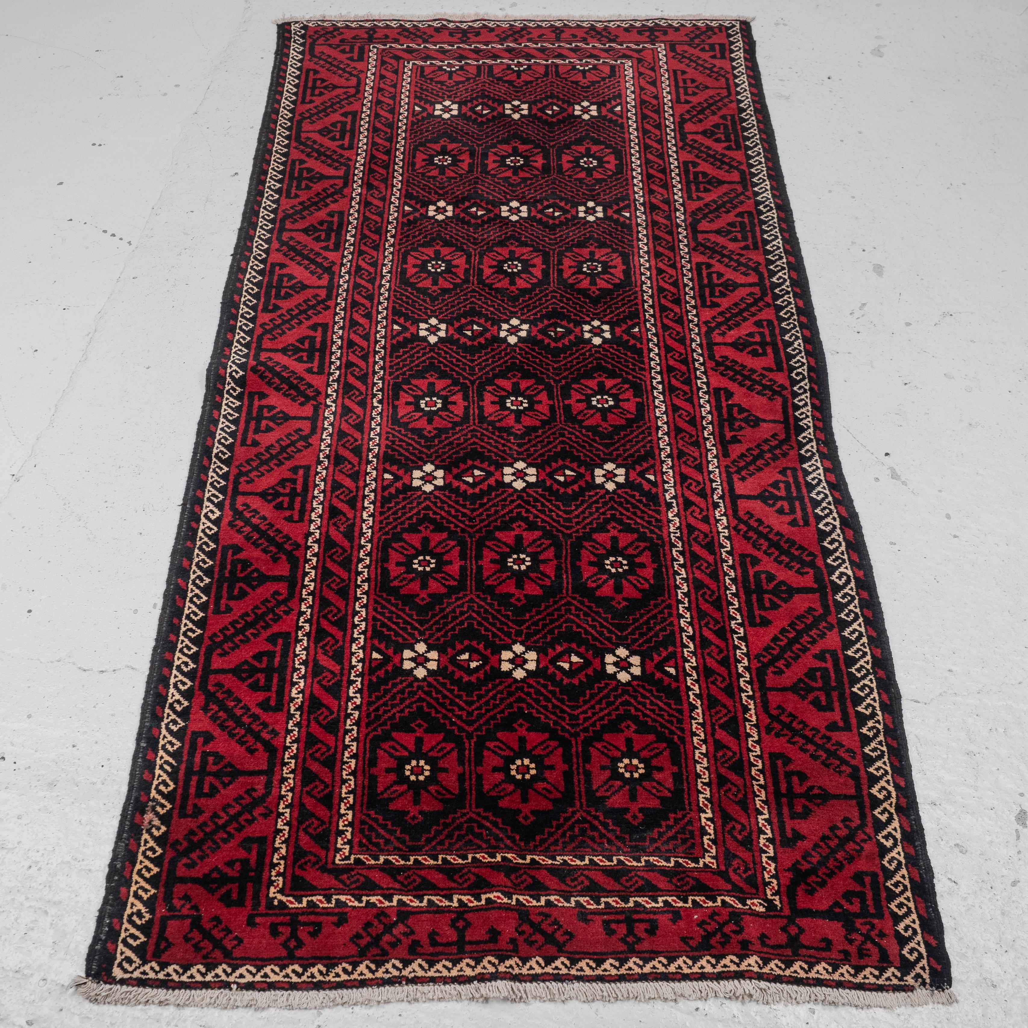 A Baluch rug of Afghan / Persian origin, approximately 7'6