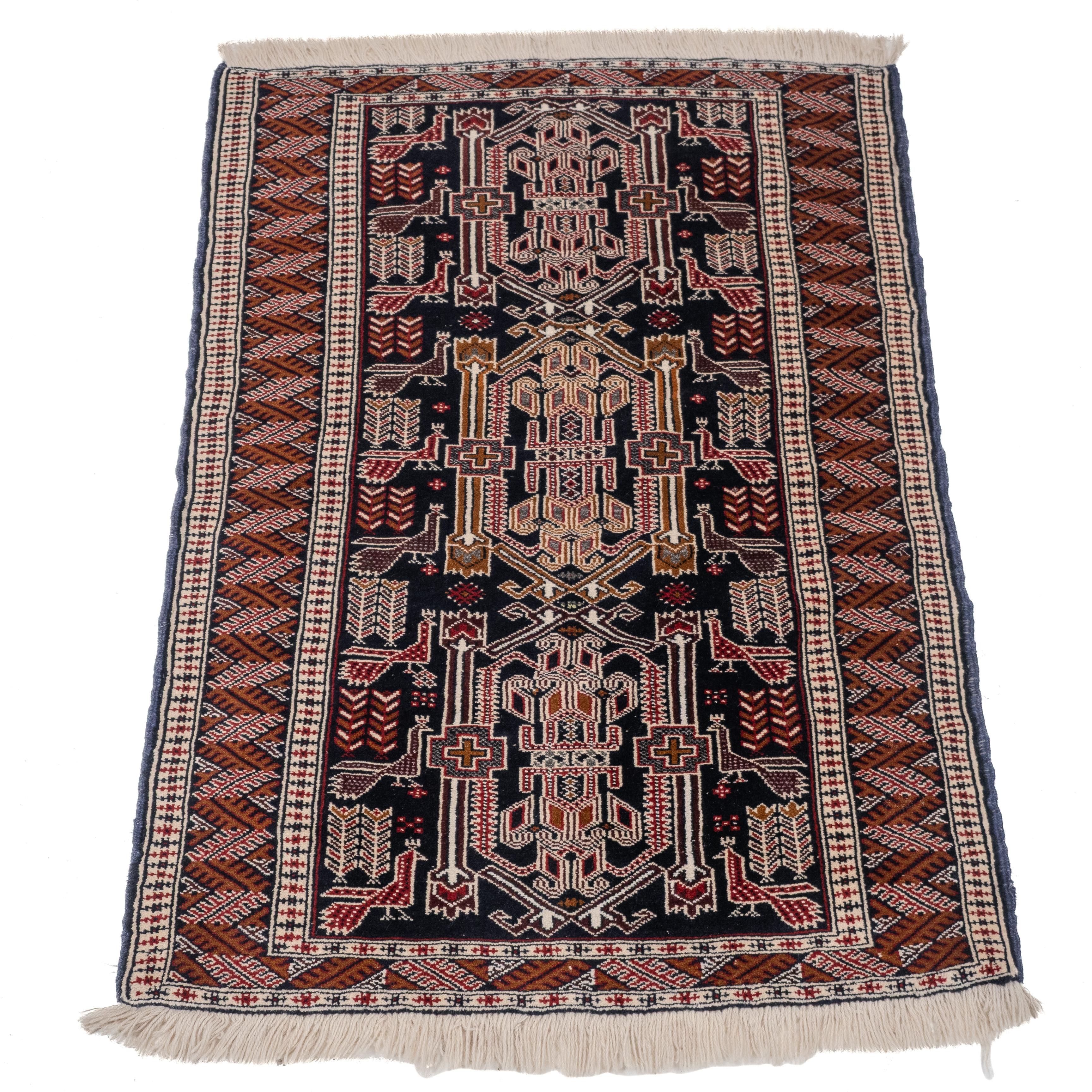 A small Baluch rug of Afghan / Persian origin, approximately 4'9
